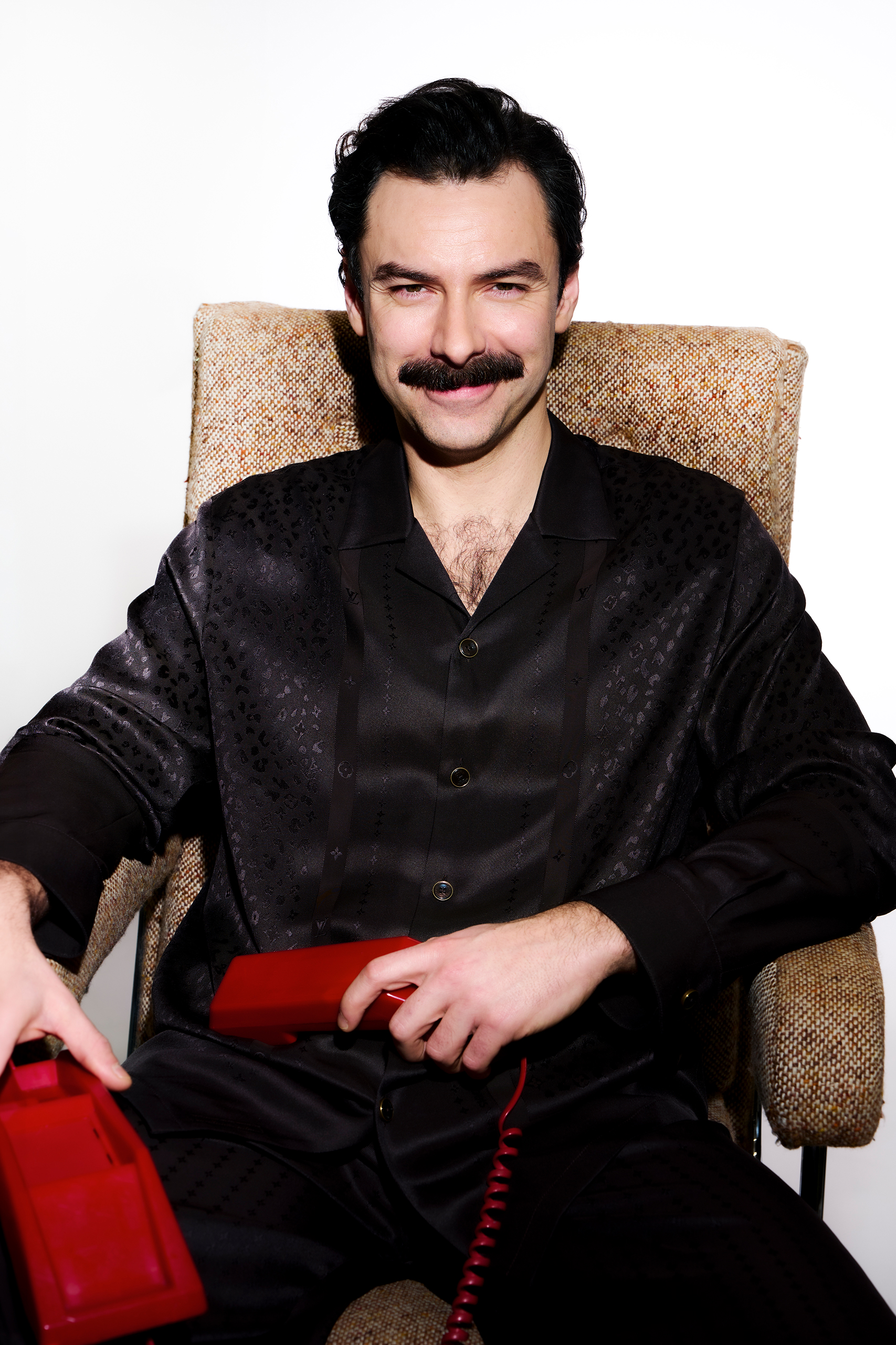 Aidan Turner wears shirt and trousers by Louis Vuitton. Top photograph: coat, shirt, tie, trousers and shoes all by Saint Laurent by Anthony Vaccarello