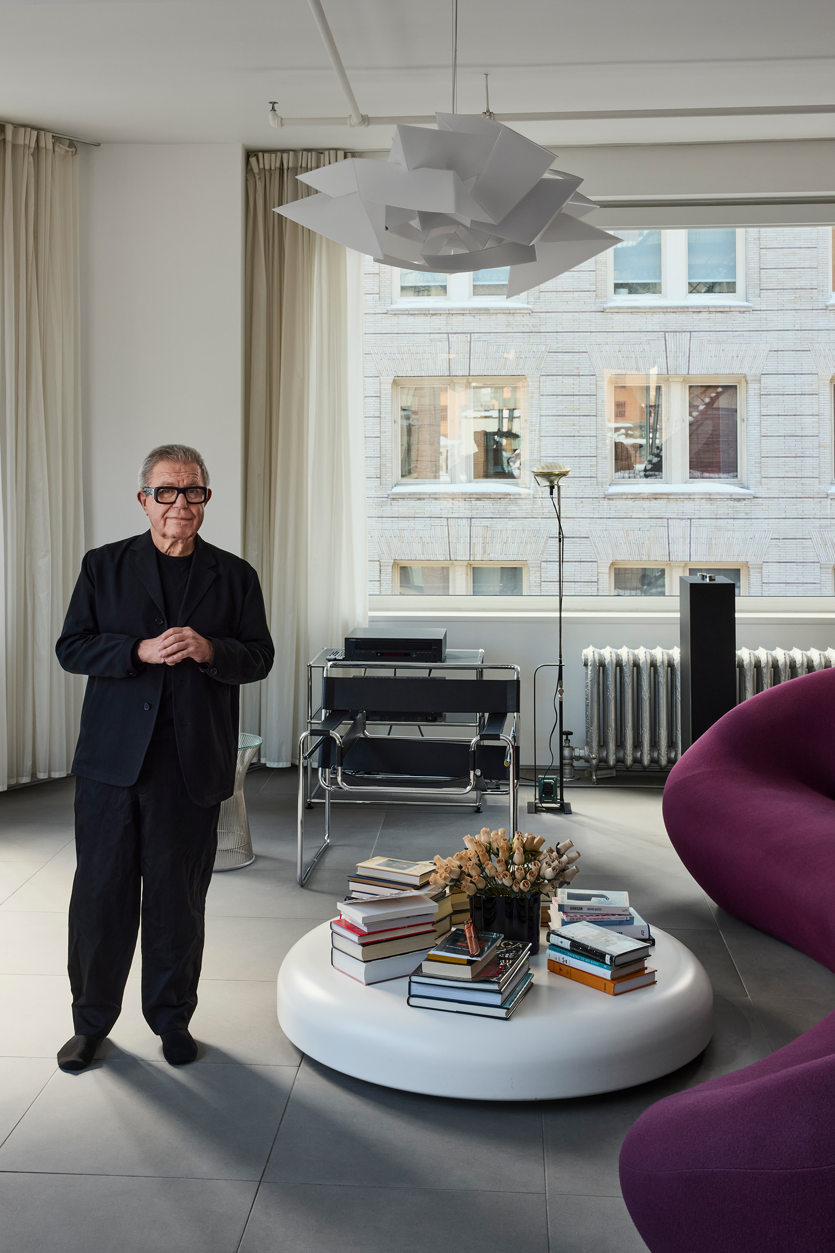 Purple reign: the huge sofa by Pierre Paulin is so big it had to be lifted through a window with a rooftop crane