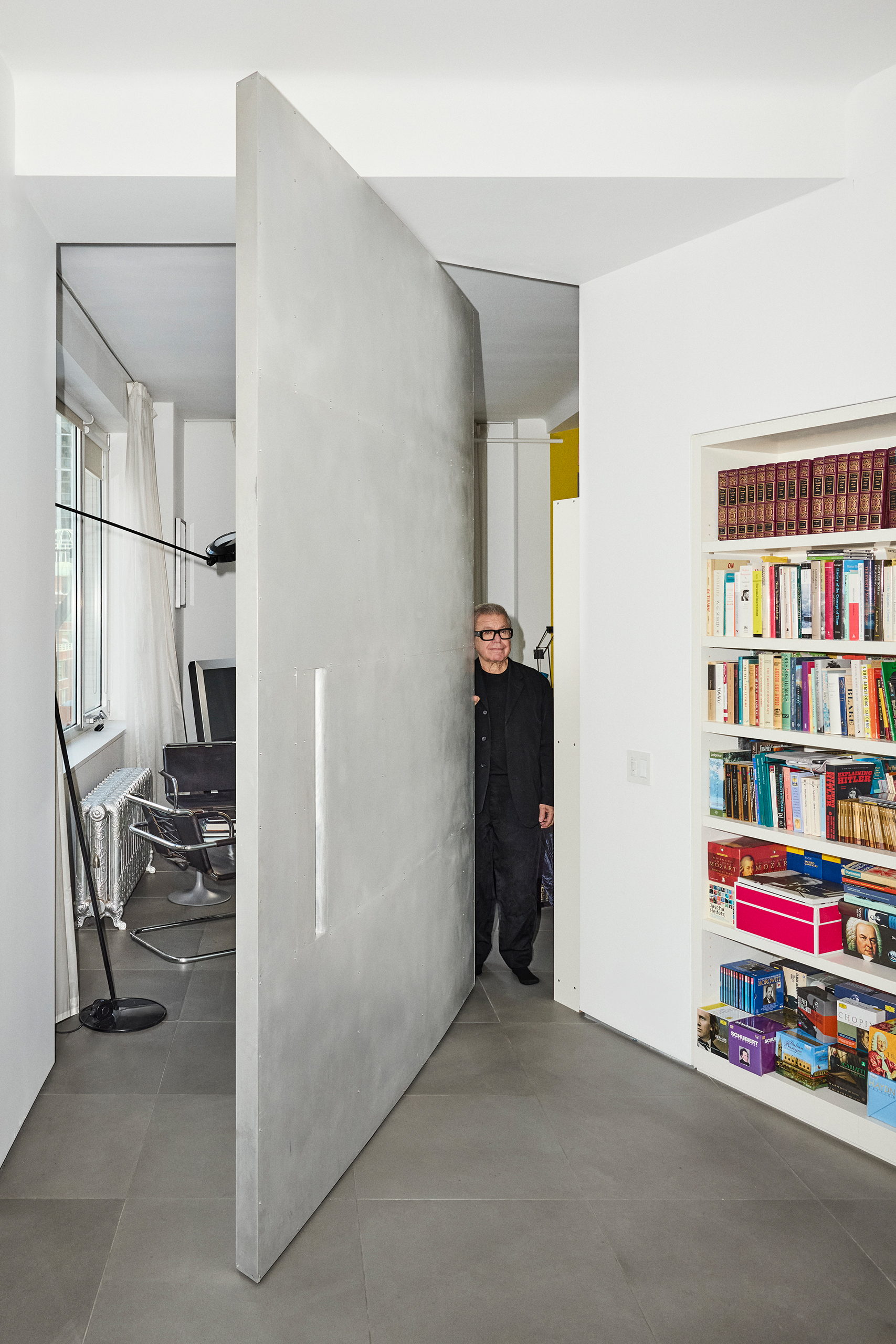 Grey matter: Daniel Libeskind peers past the aluminium-clad pivoting door