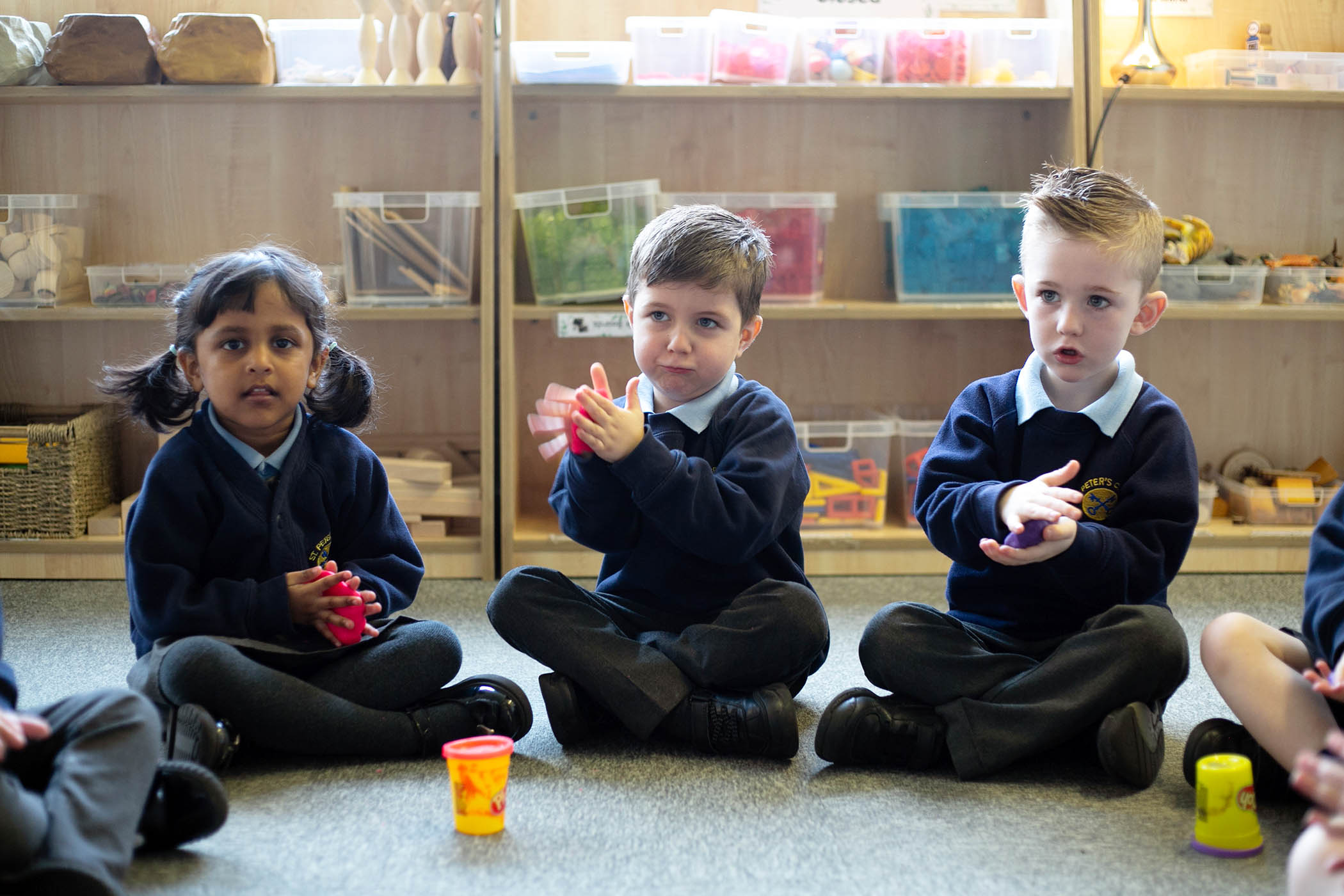 Children with play dough in Reception class at St Peter's Church of England primary school in Hindley , Wigan in Greater Manchester.