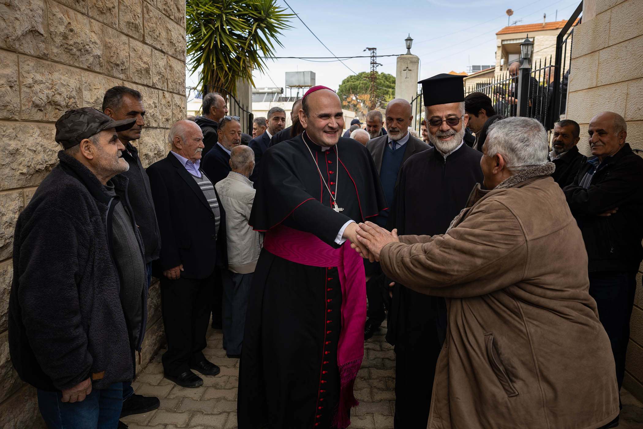 Archbishop Paolo Borgia is greeted as he arrives in Rachaya el-Foukhar