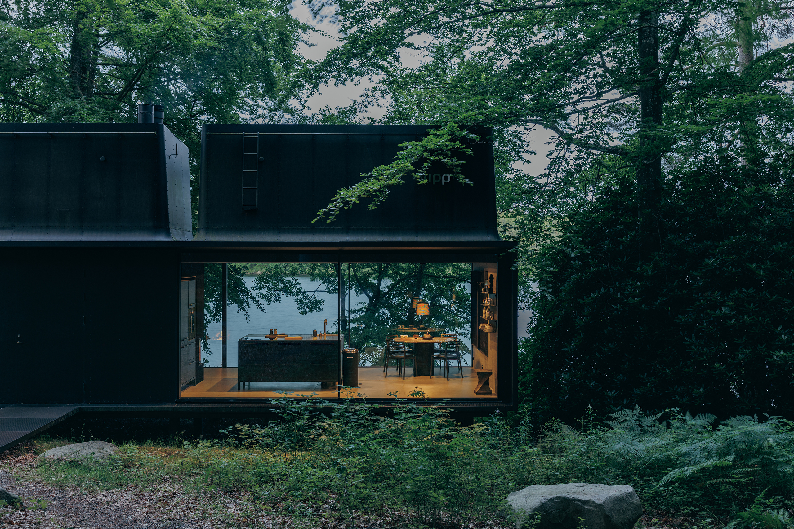 Sweden: the first of the Vipp guesthouses to be built, the black steel structure by lake Immeln was made as a prefab
