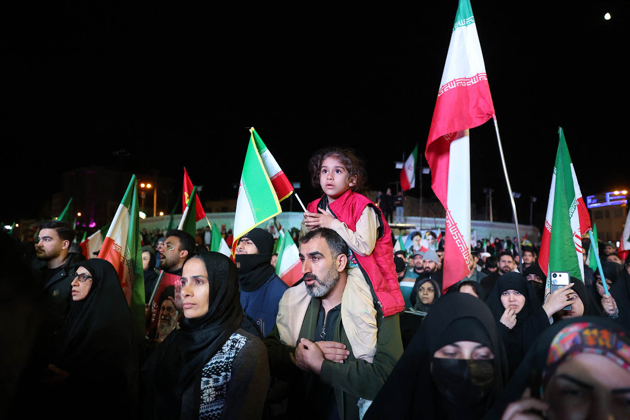 Iranians gather in Tehran’s Engelab Square last night after the ceasefire was announced