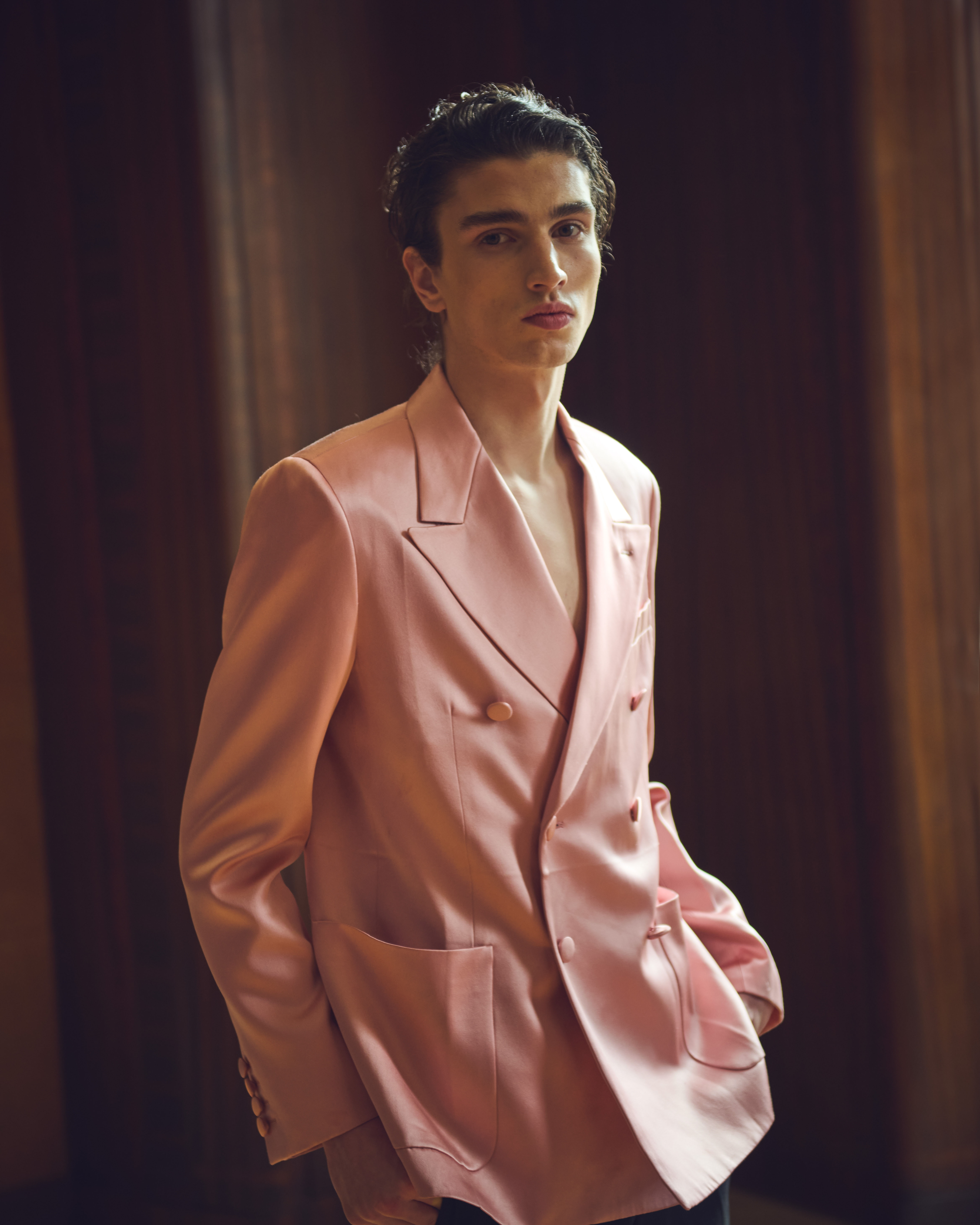 Louis wears silk blazer and trousers by Valentino