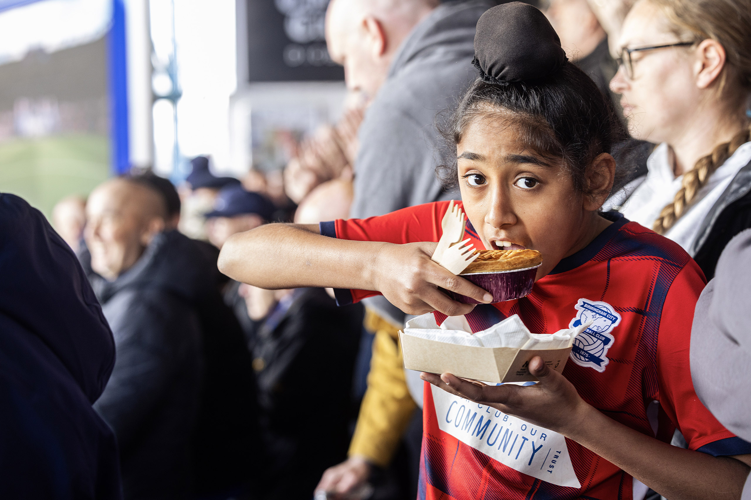The right stuff: Armaan Singh, 12, Birmingham City season ticket holder, with a Pukka Chicken Balti pie in the main stand