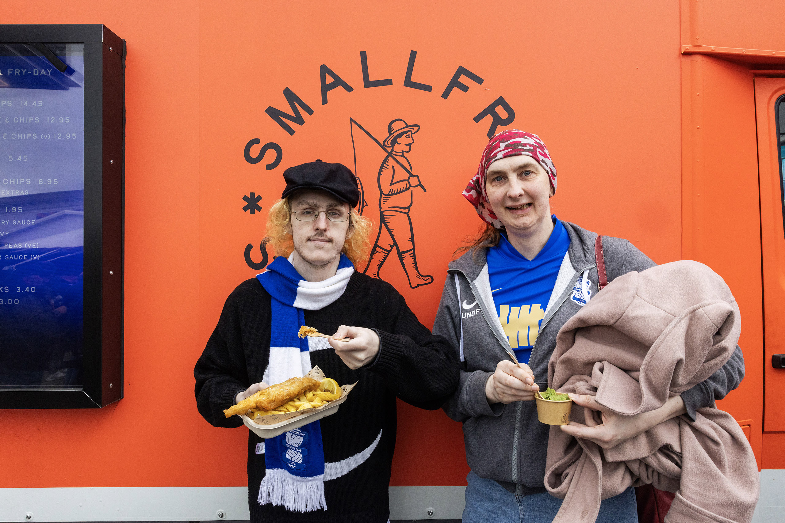Great chip: Blues fans Scott Carruthers (left) and Abi Cornell at the Small Fry Fish and Chips van