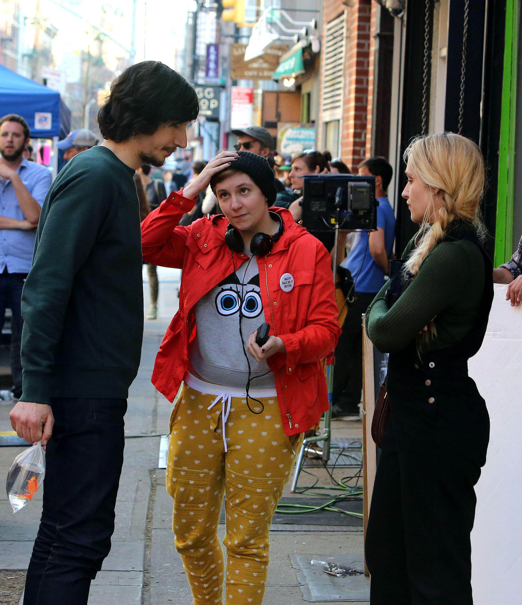 Dunham (centre) with co-stars Adam Driver and Jemima Kirke on the set of Girls in New York, 2015.