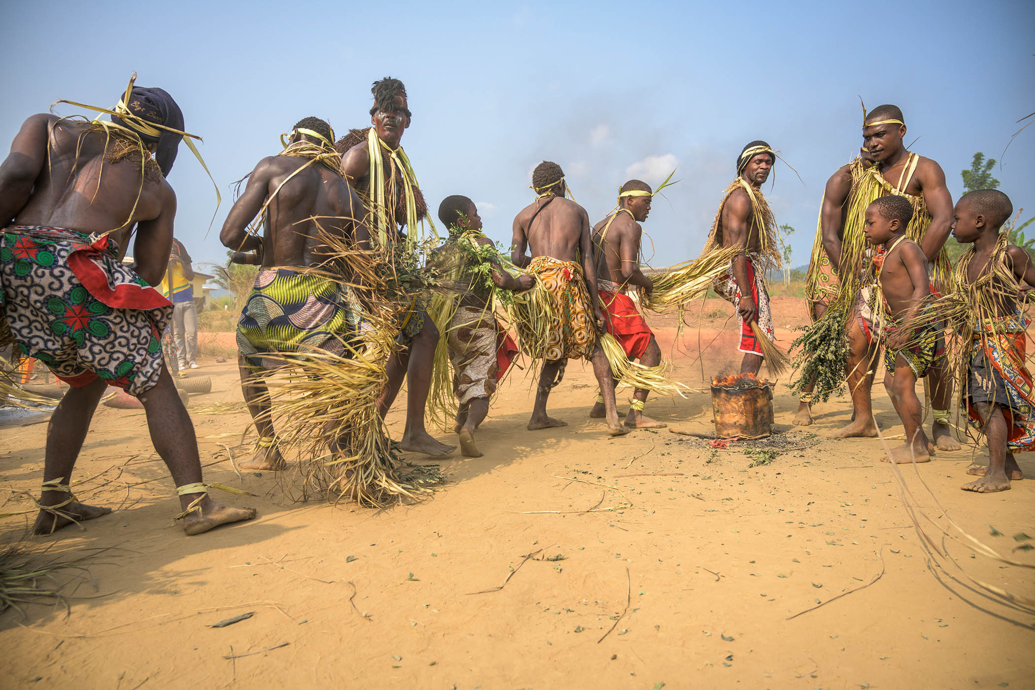 Dancers in Ngoubié province, Gabon gather after an all-night Bwiti ceremony involving the consumption of iboga