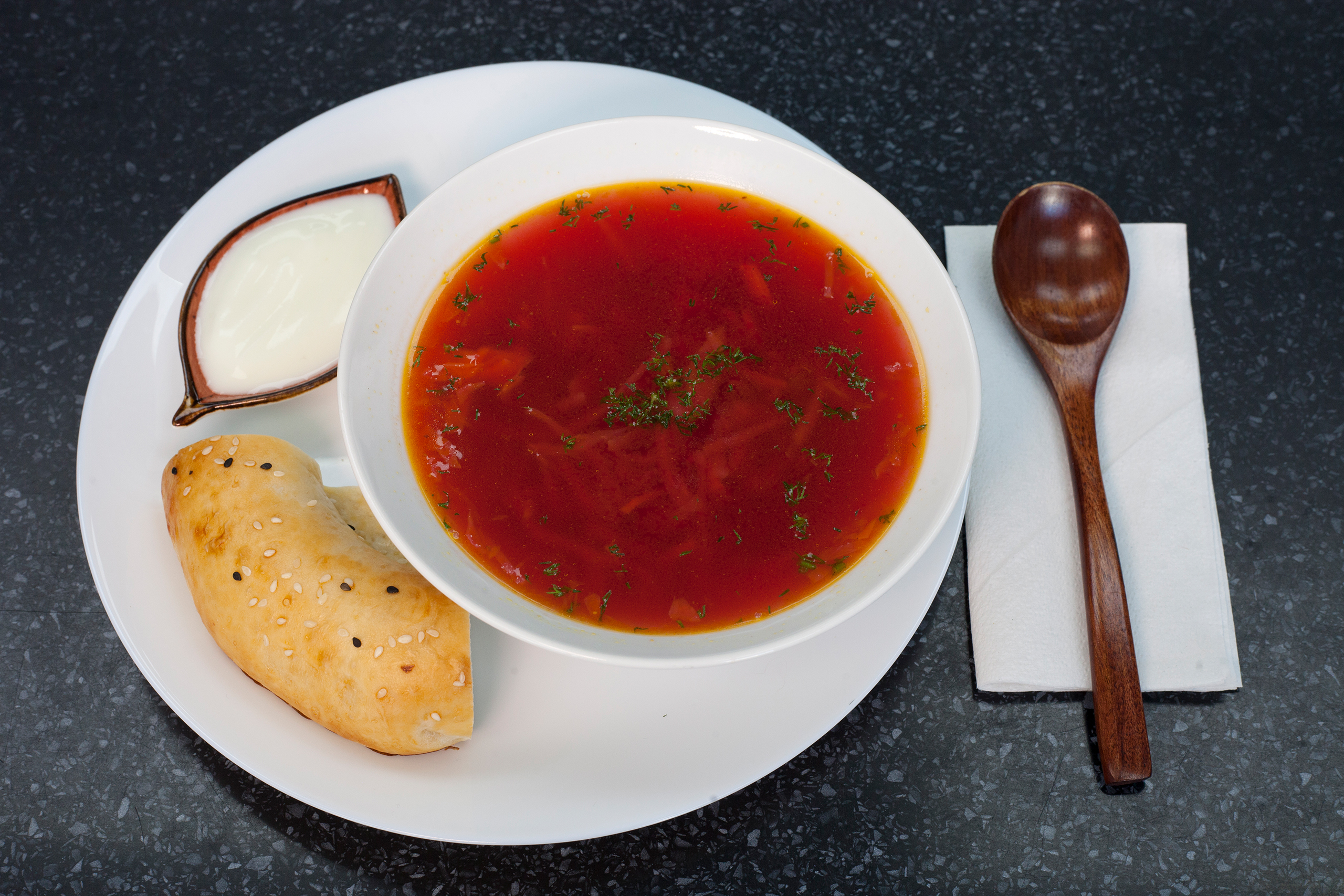 ‘Served with the round, studded non bread ubiquitious in Central Asia’: borscht