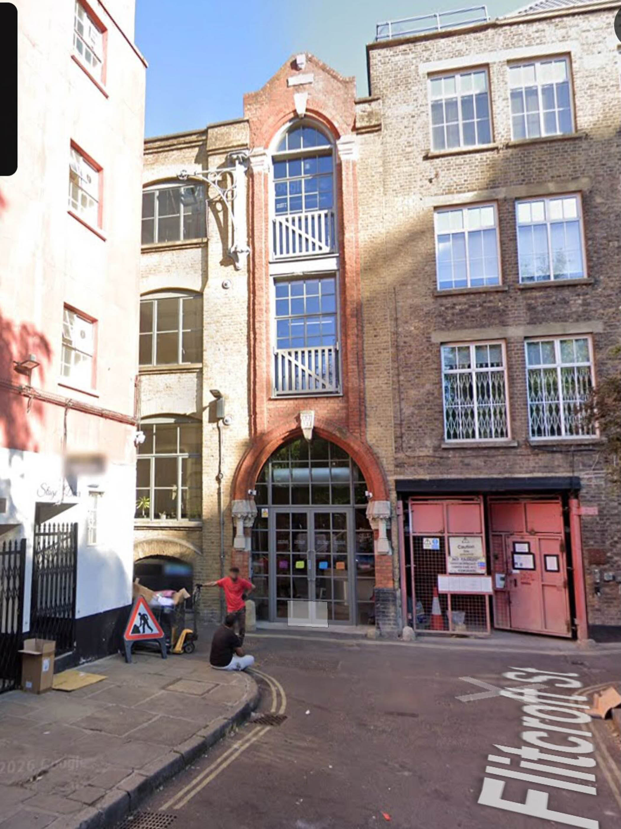The warehouse building’s exterior, with its metal gates