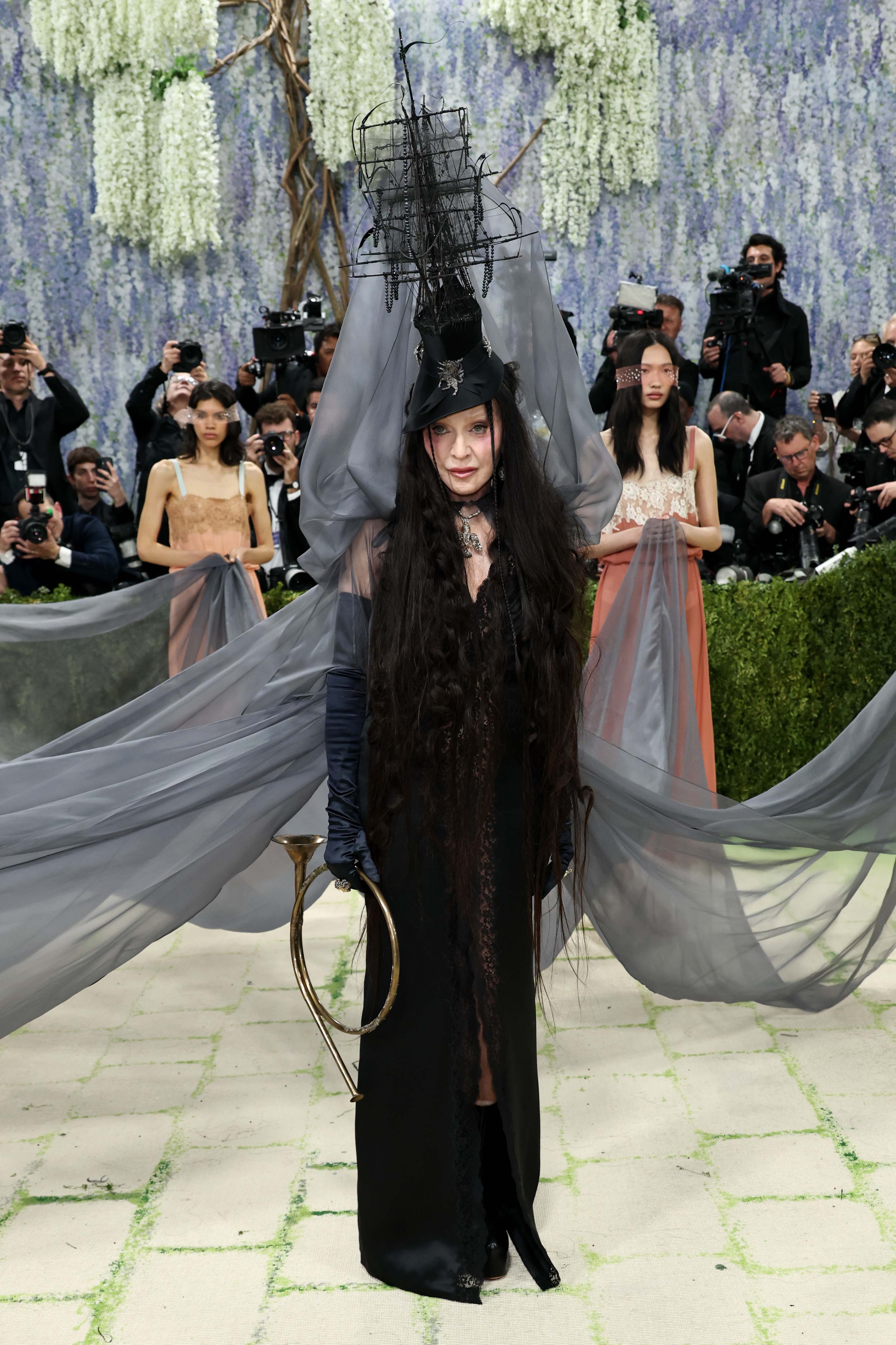 Fresh from her performance with Sabrina Carpenter at Coachella, Madonna made one of the biggest entrances of the evening wearing Saint Laurent – complete with ghost ship headdress and  accompanied by seven handmaids carrying her chiffon veil. The look referenced surrealist painter Leonora Carrington, who was an inspiration for the singer’s classic Bedtime Story music video.