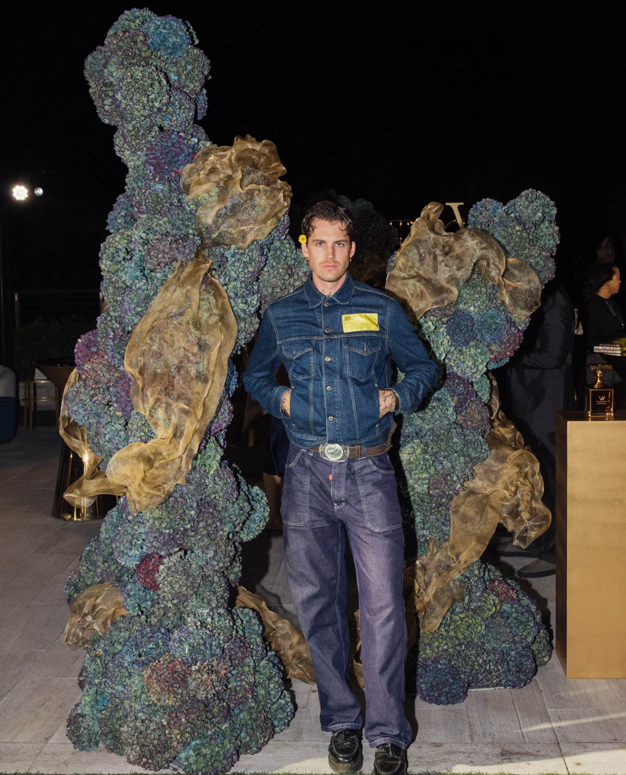 Powell with floral sculptures he created for Johnnie Walker
