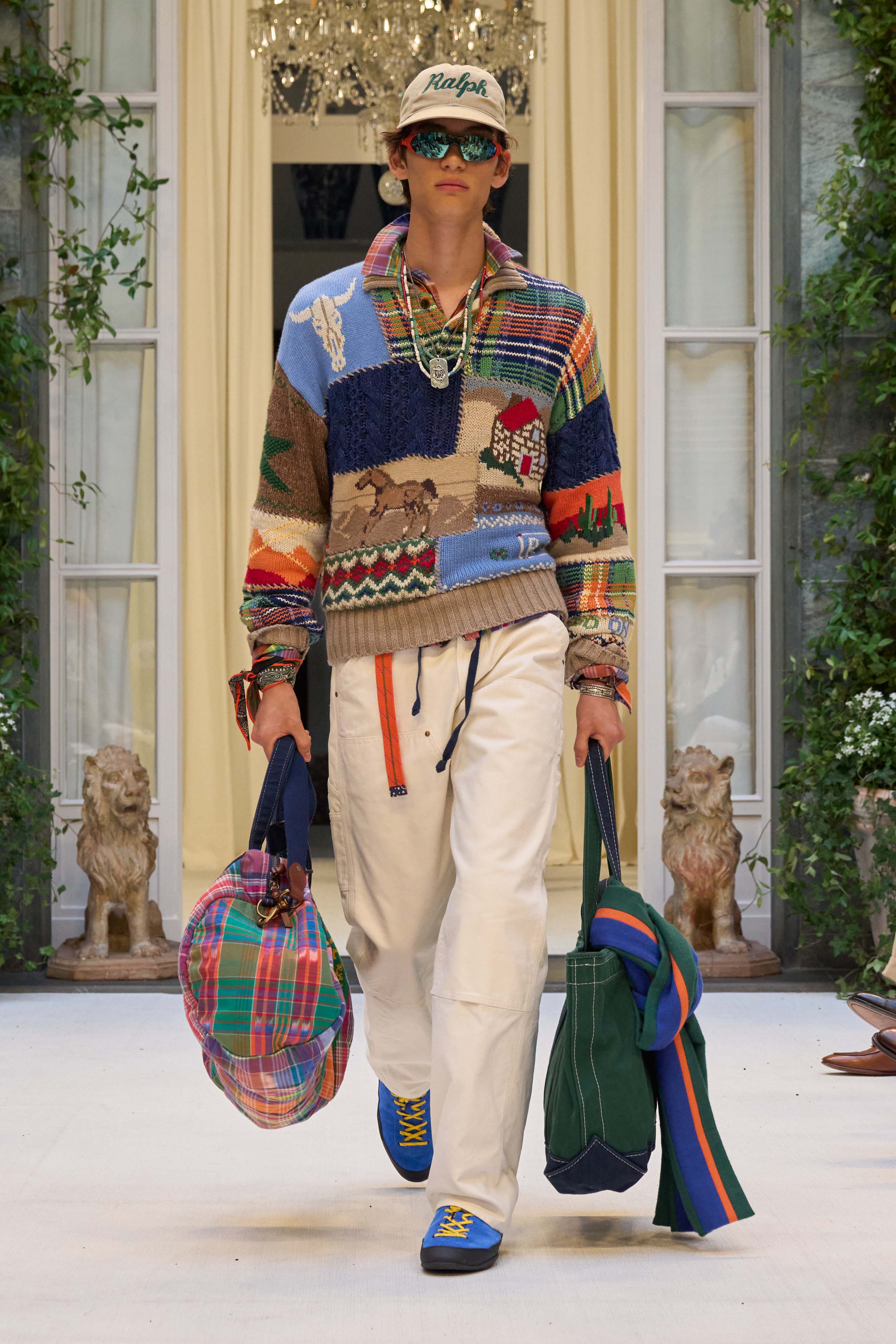 RALPH LAURENPresented as a double bill, Ralph Lauren showed Purple Label followed by Polo at his Milan HQ. Star guests included Lewis Hamilton, Colman Domingo and Tom Hiddleston, all immaculately turned out. “When I began designing menswear, my inspiration came from the ease and traditions of collegiate style and the gentleman athlete,” Lauren explained in his show notes. “It was about character and camaraderie, a timeless style they made their own.” Those archetypal characters were seen on the runway – the elegant gent of Purple Label with an enviable evening-wear wardrobe and the cool young prepster of Polo. It was the Polo section that proved the scene-stealing star. Every look was a visual delight in uplifting colour and pattern combinations; contrasting check shirts were layered up, sometimes three at a time, homespun patchwork knits were paired with loose-cut casual chinos. Standout pieces included a vintage-inspired varsity jacket and collegiate shopper bags. Lauren’s next-generation vision of American prep has never looked better.