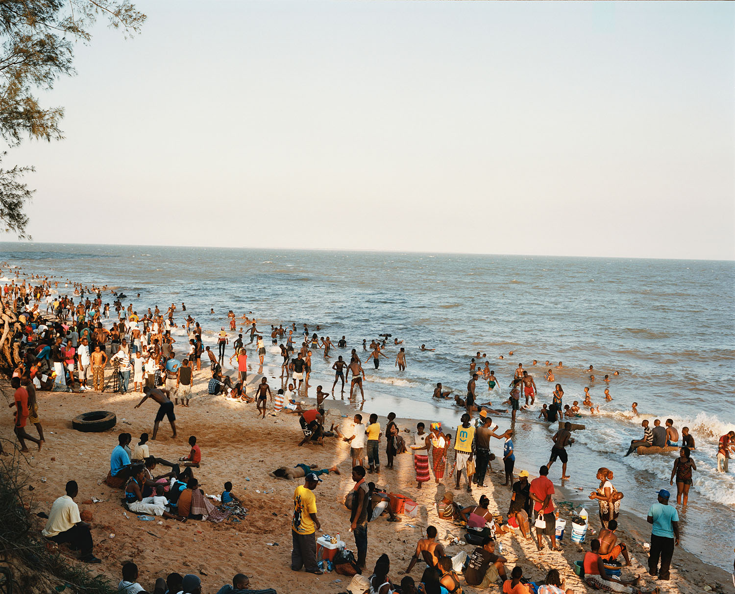 Families flock to a public beach.