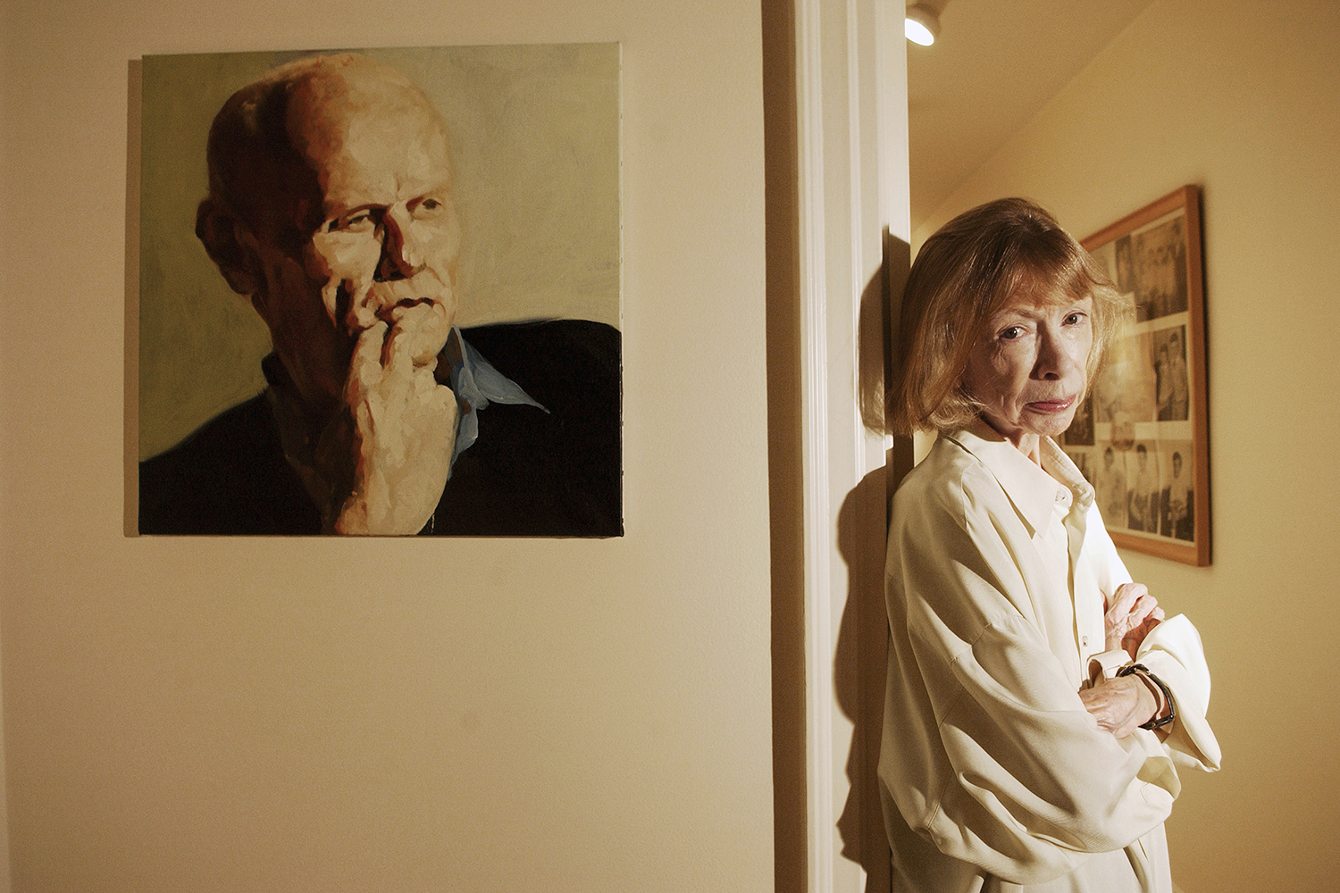 Joan Didion, photographed at home in New York, in 2006, with a portrait of her husband, John Gregory Dunne. Their collected papers, below, were sold to New York’s public library. Jennifer S Altman/Getty