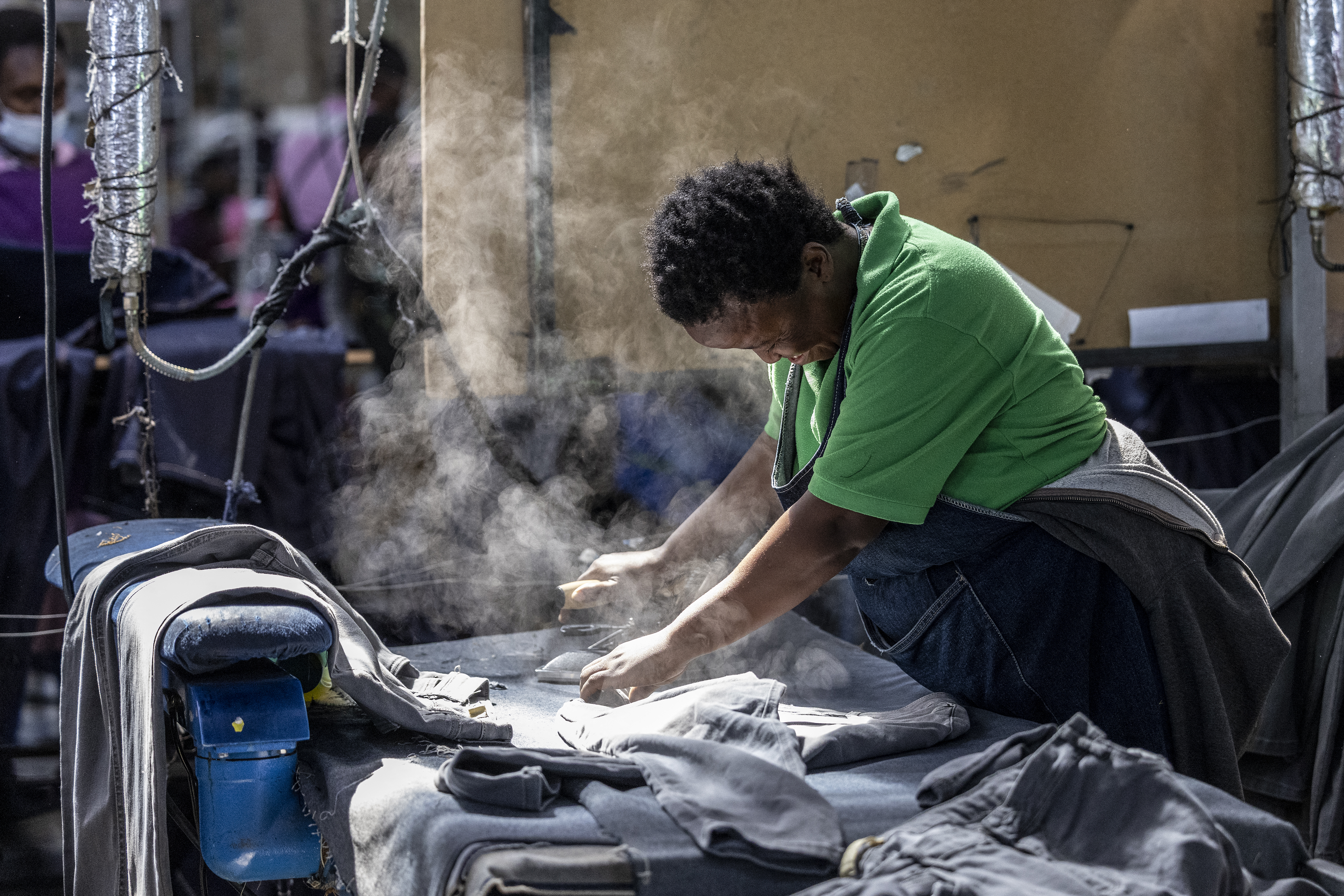 A factory worker presses denim in a factory in Lesotho, southern Africa, in March, a month before Trump hit the tiny country with 50% tariffs.  AFP
