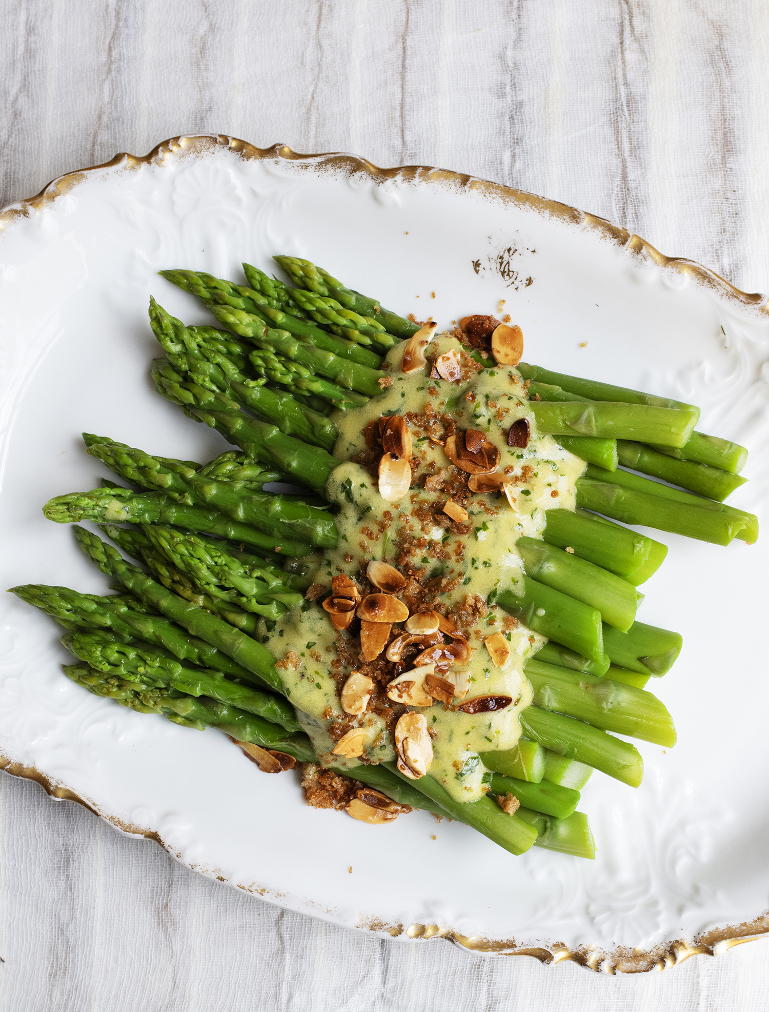 Top tips: a smooth mustardy tarragon sauce and crisp almond crumbs are a perfect match for fresh, new-season asparagus
