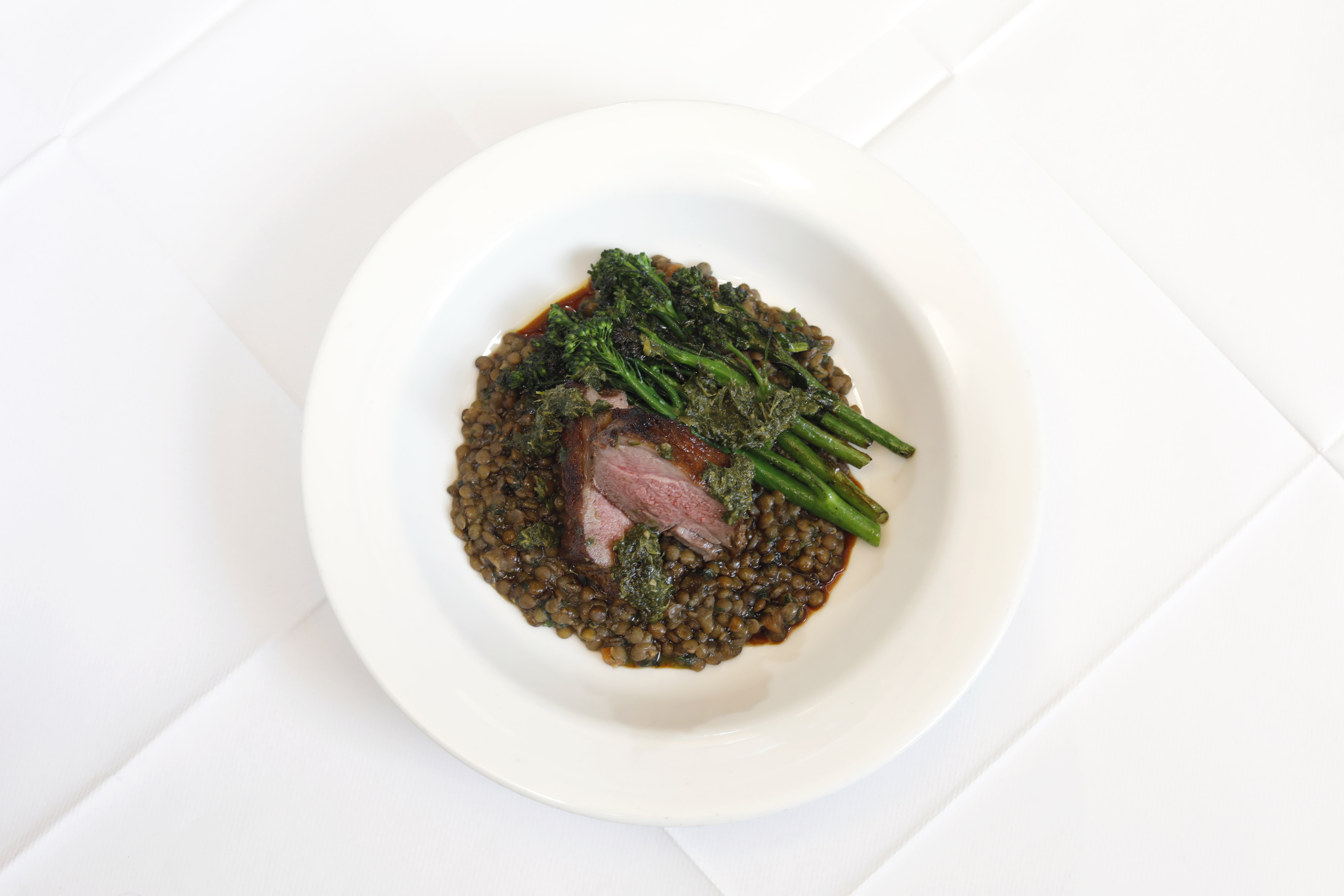 ‘Soft and buttery’: lamb with salsa verde, lentils and tenderstem broccoli