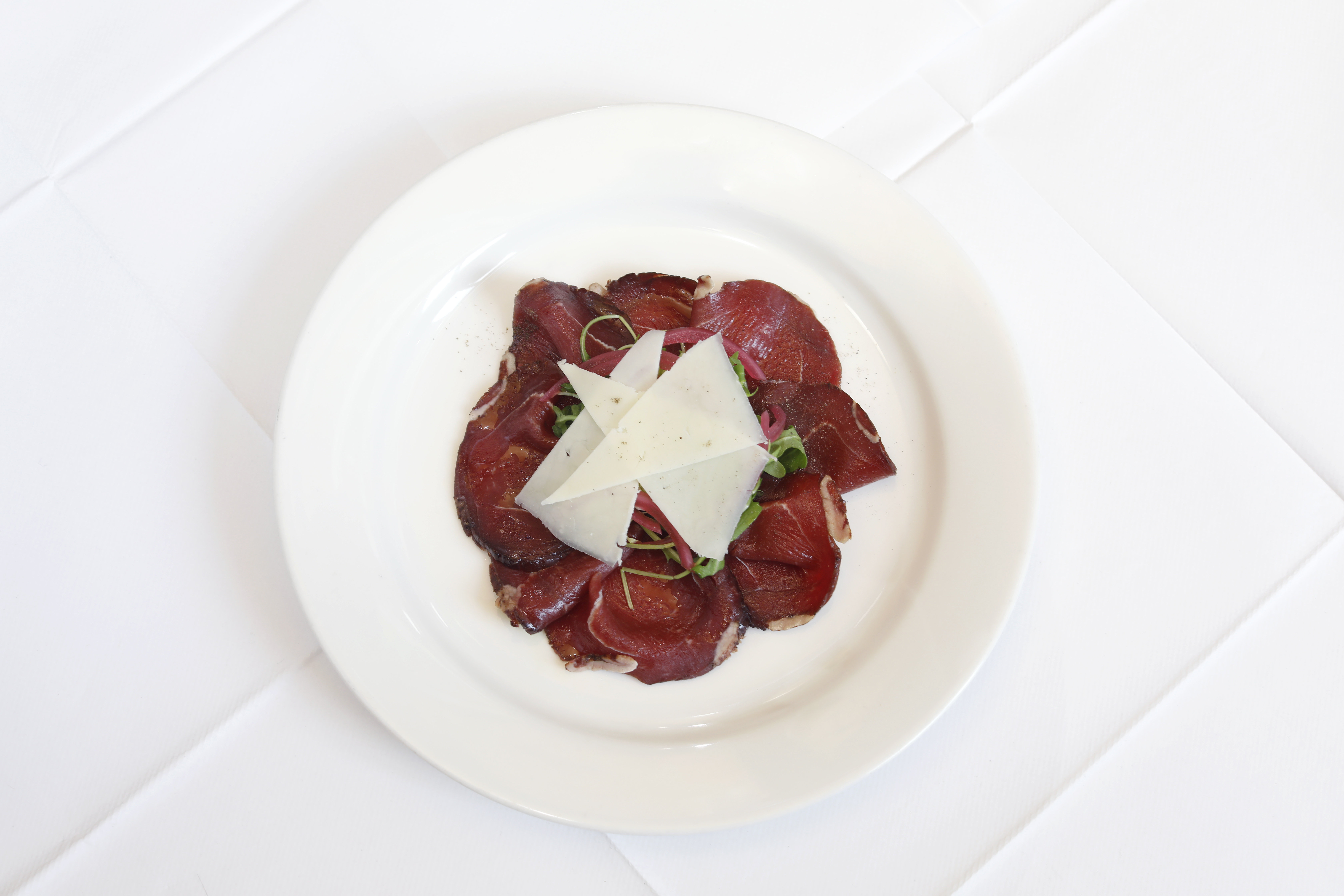 ‘A wonderful texture’: Great Glen venison bresaola with Corra Linn cheese, rocket and red onion