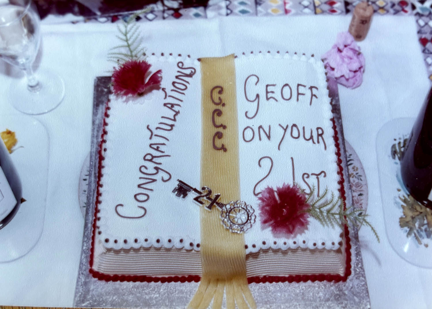 Geoff’s book-shaped birthday cake, with the initials of his Oxford college down the middle