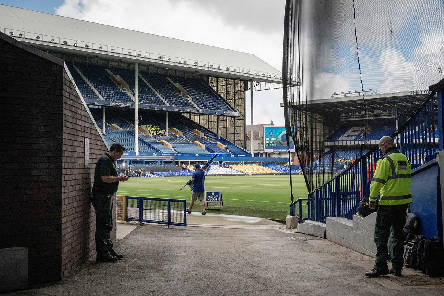 A fan carries a flag around Goodison Park ahead of Everton’s penultimate game at the stadium