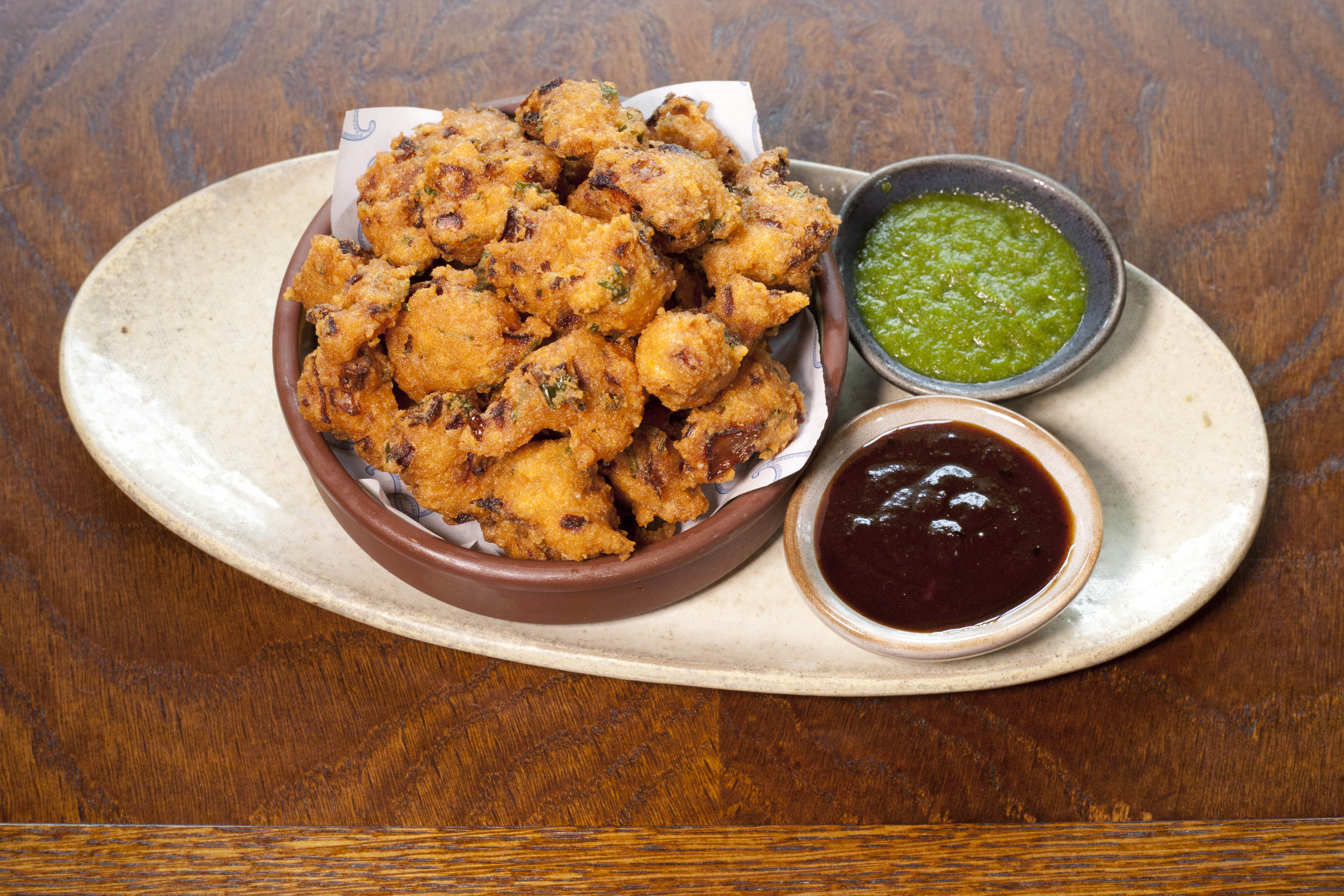 ‘Enough bihari phulkis – a street snack, lentil fritters with tamarind – arrive to feed a street’