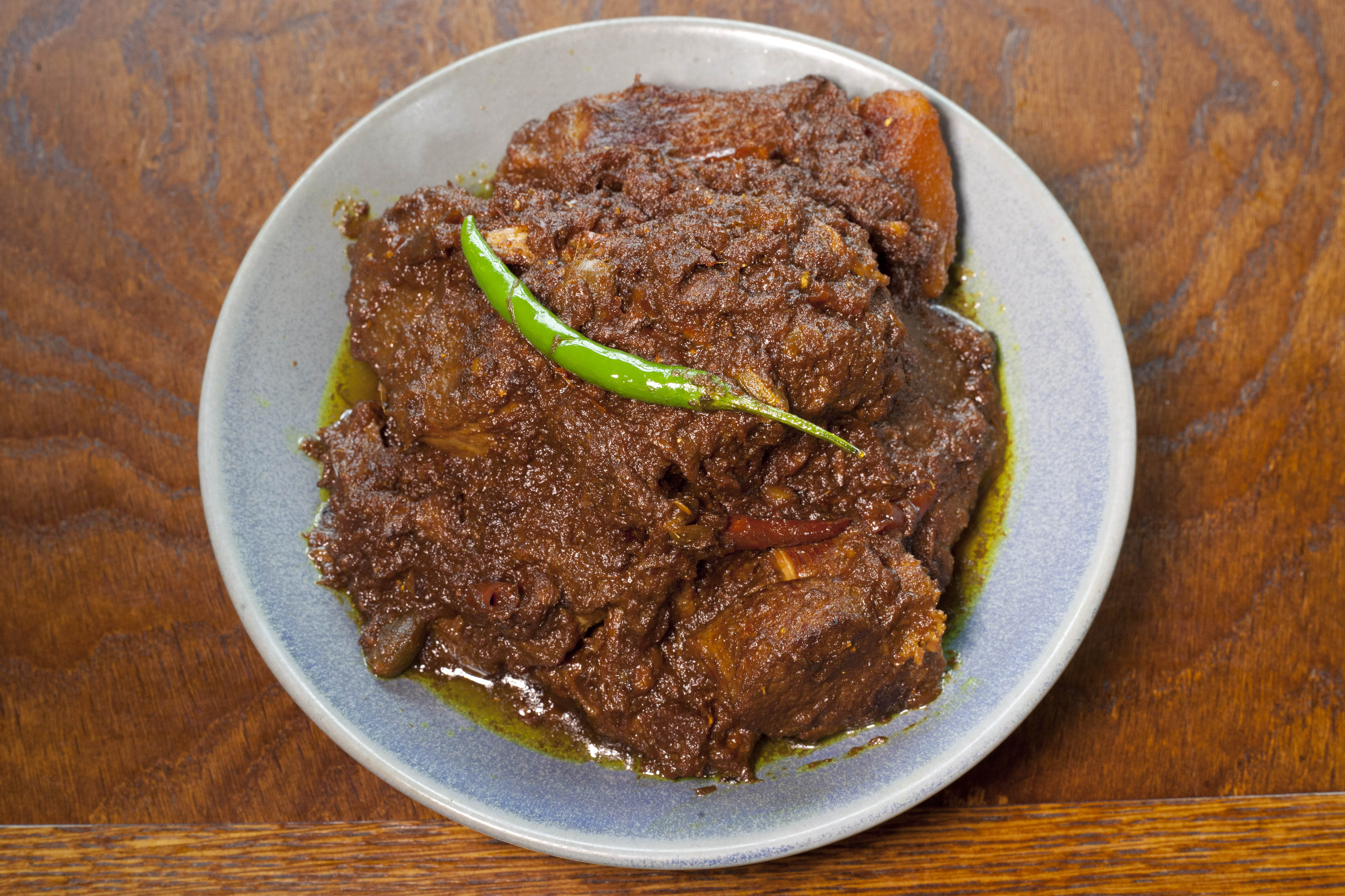 ‘The sauce holds the falling-off-the-bone mutton in its fiery, aromatic grasp’: kosha mangsho
