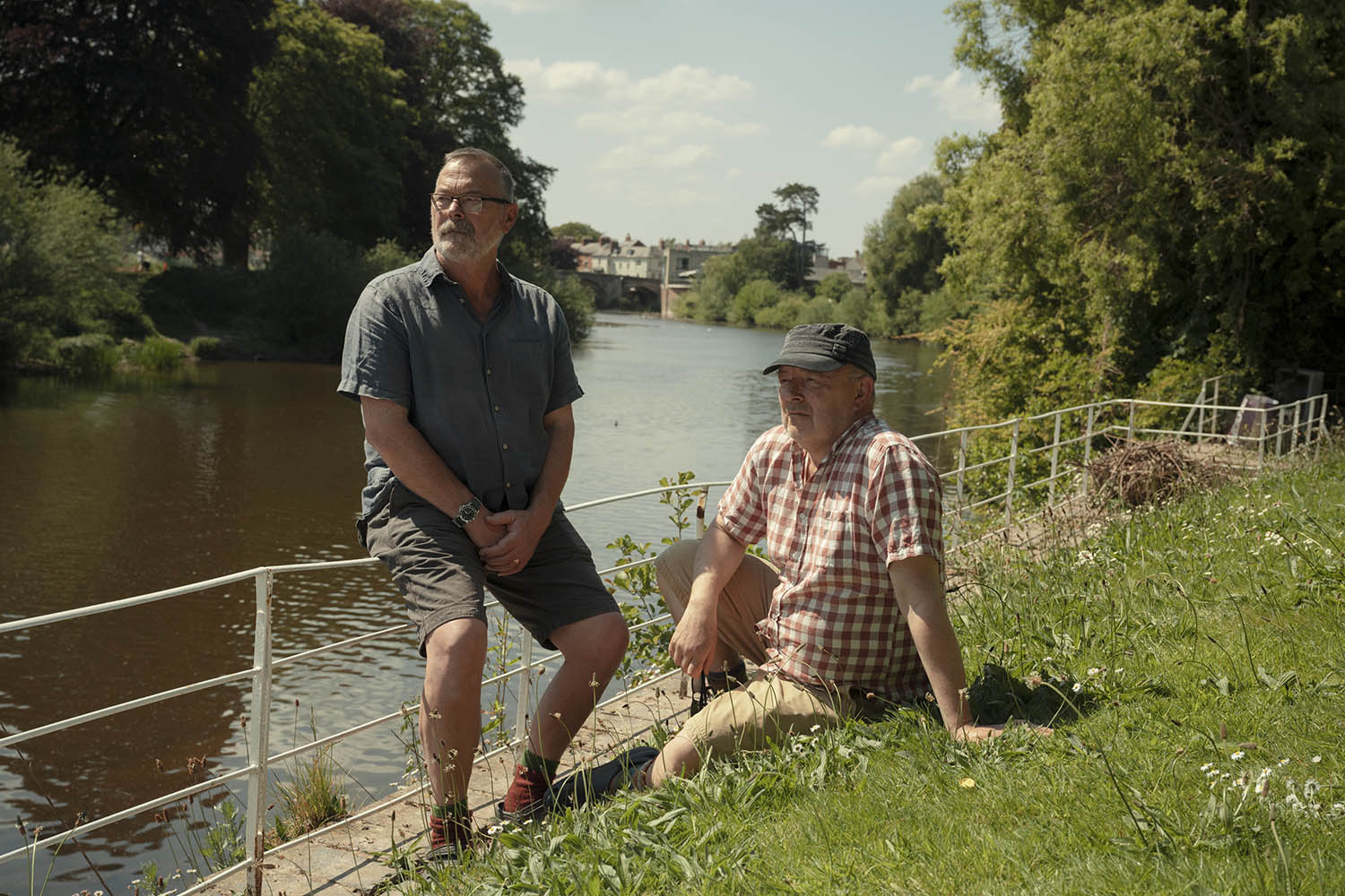 Phil Wilson and Mark Hubbard in their garden next to the River Wye.