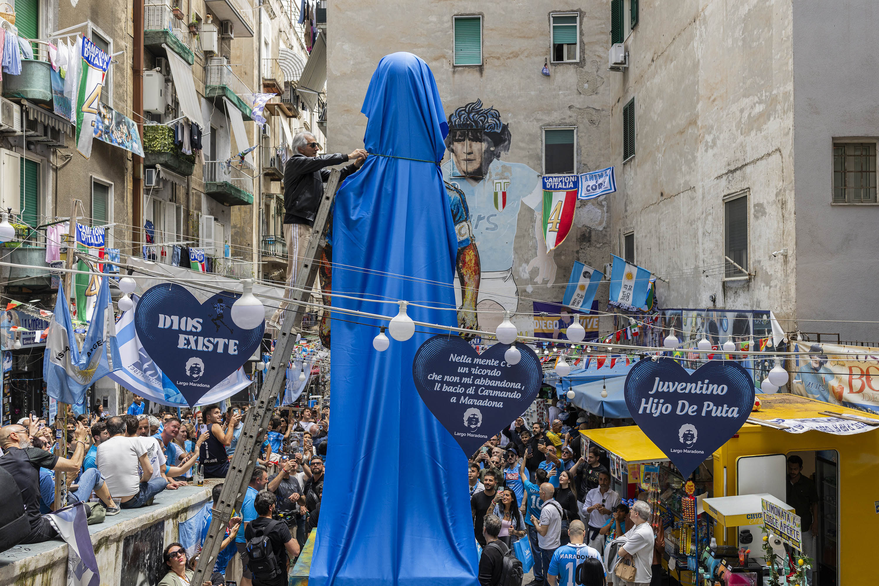 Final touches are made to a new statue of Diego Armando Maradona in the Quartieri Spagnoli