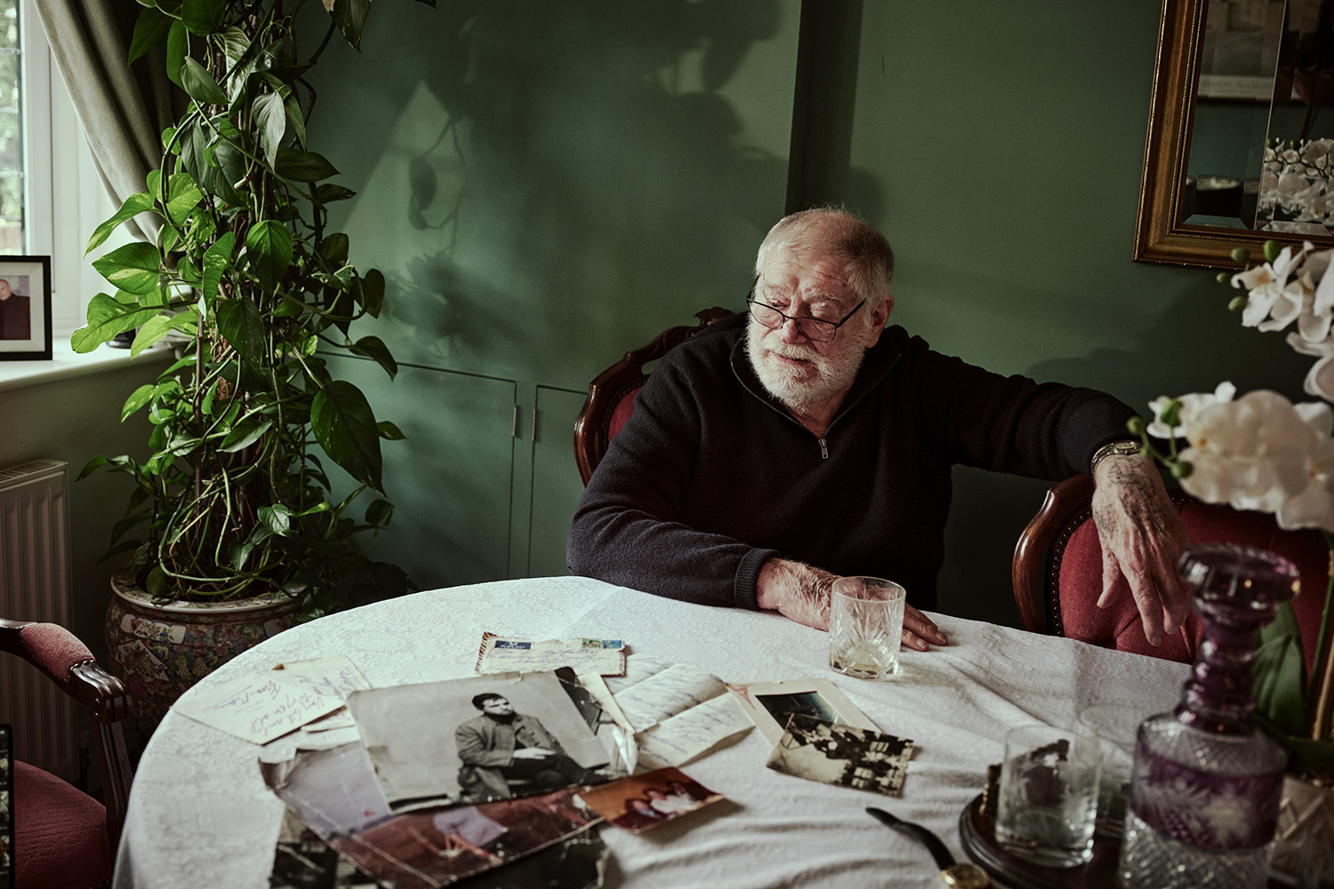 Ted at his home in Thurrock, Essex. On the table, memories of his friendship with Bacon