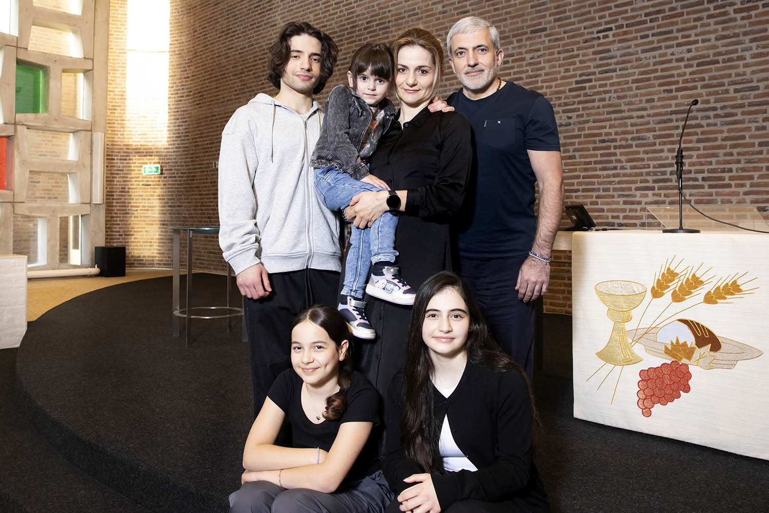 The Babayants family, clockwise from top left, Aram (20), Aleksa (2), mother Karina, father Aleksandr, Ariana (13) and Amelia (10).