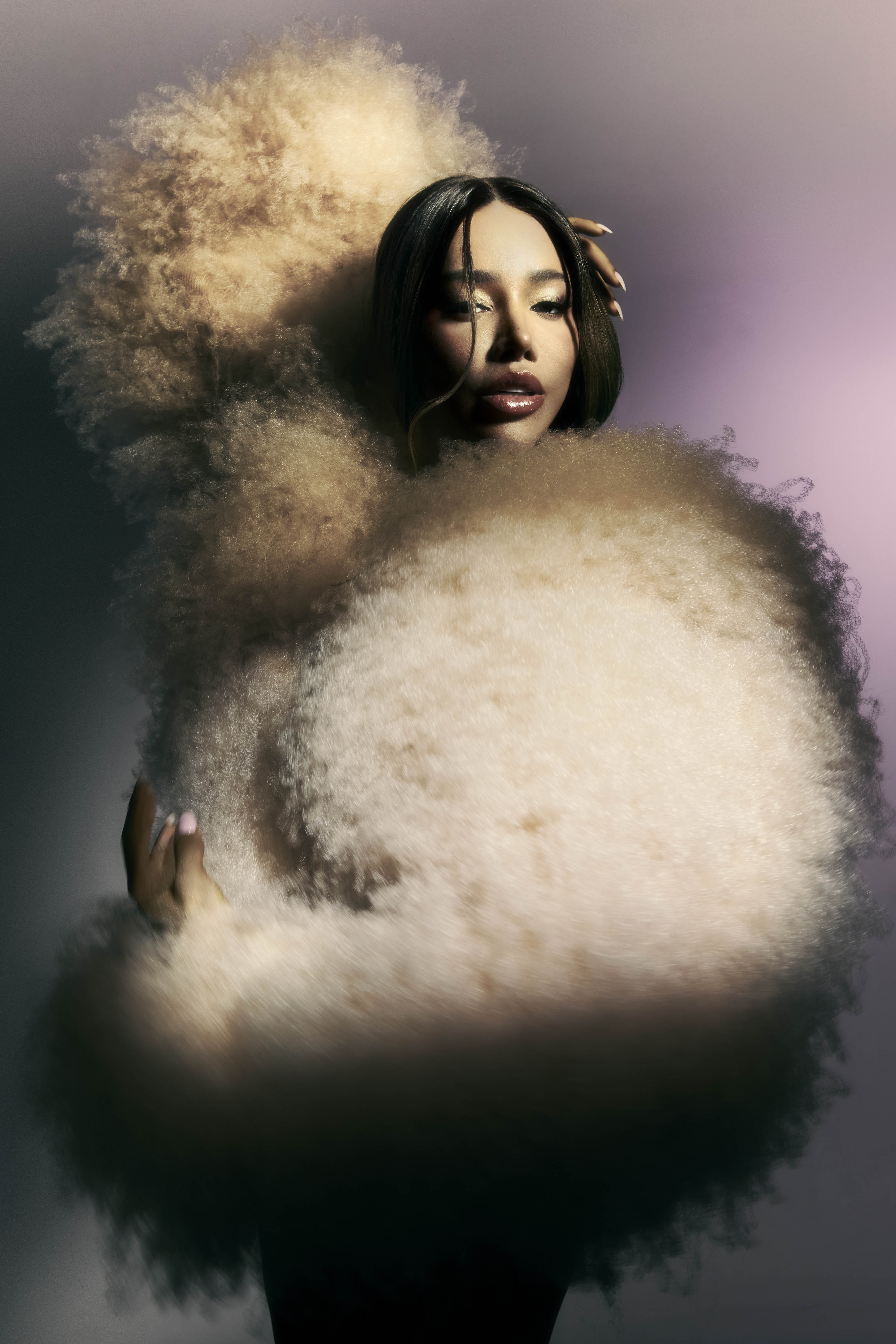 ‘My life looks extremely different now’: Munroe Bergdorf wears fluffy cardigan by Stella McCartney. Image above: sweater, dress and stole all by Issey Miyake; cuff by Hannah Martin London