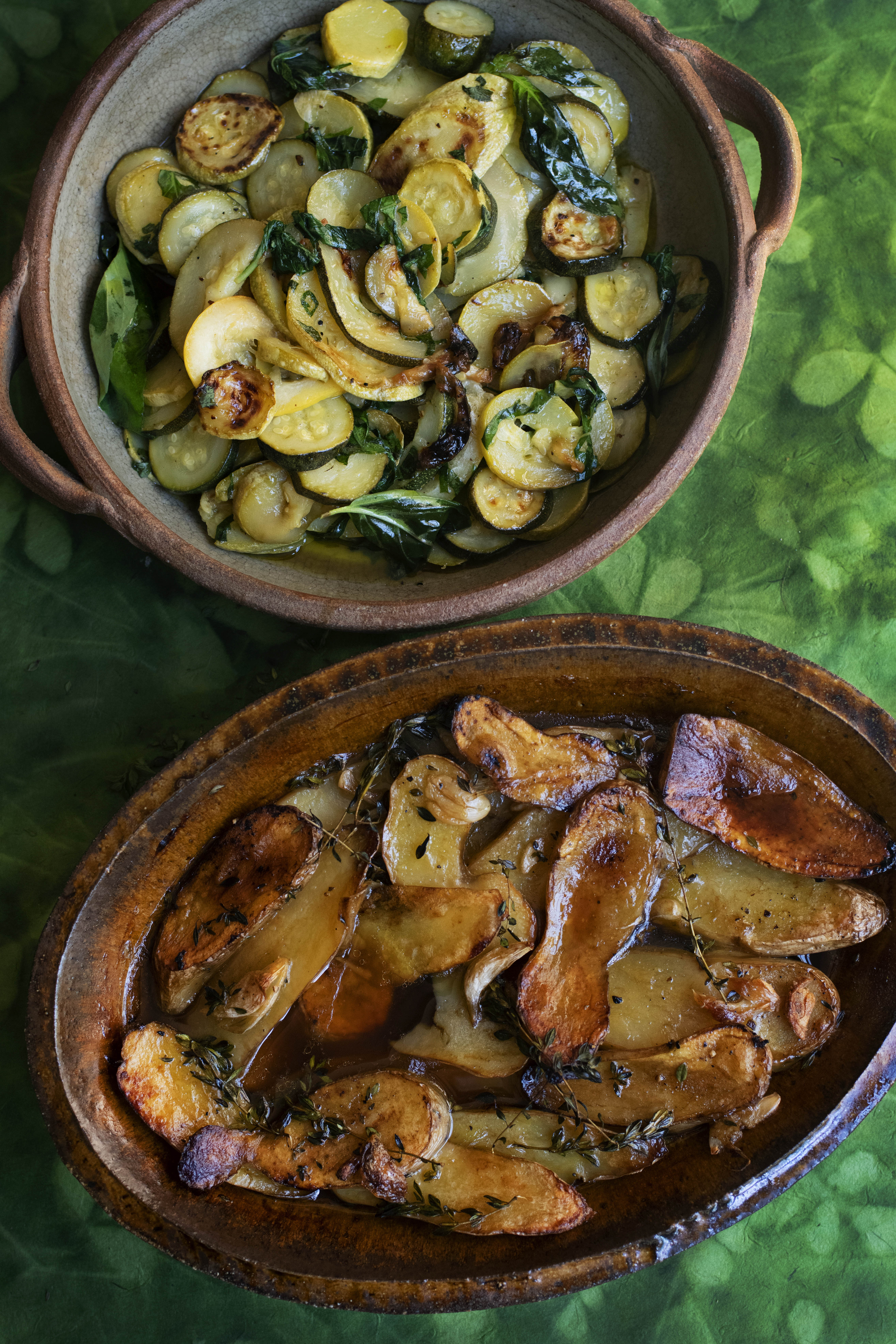 Soft and slow: (from top) courgettes cooked with garlic, lemon and basil; and baked new potatoes served in stock with lemon thyme
