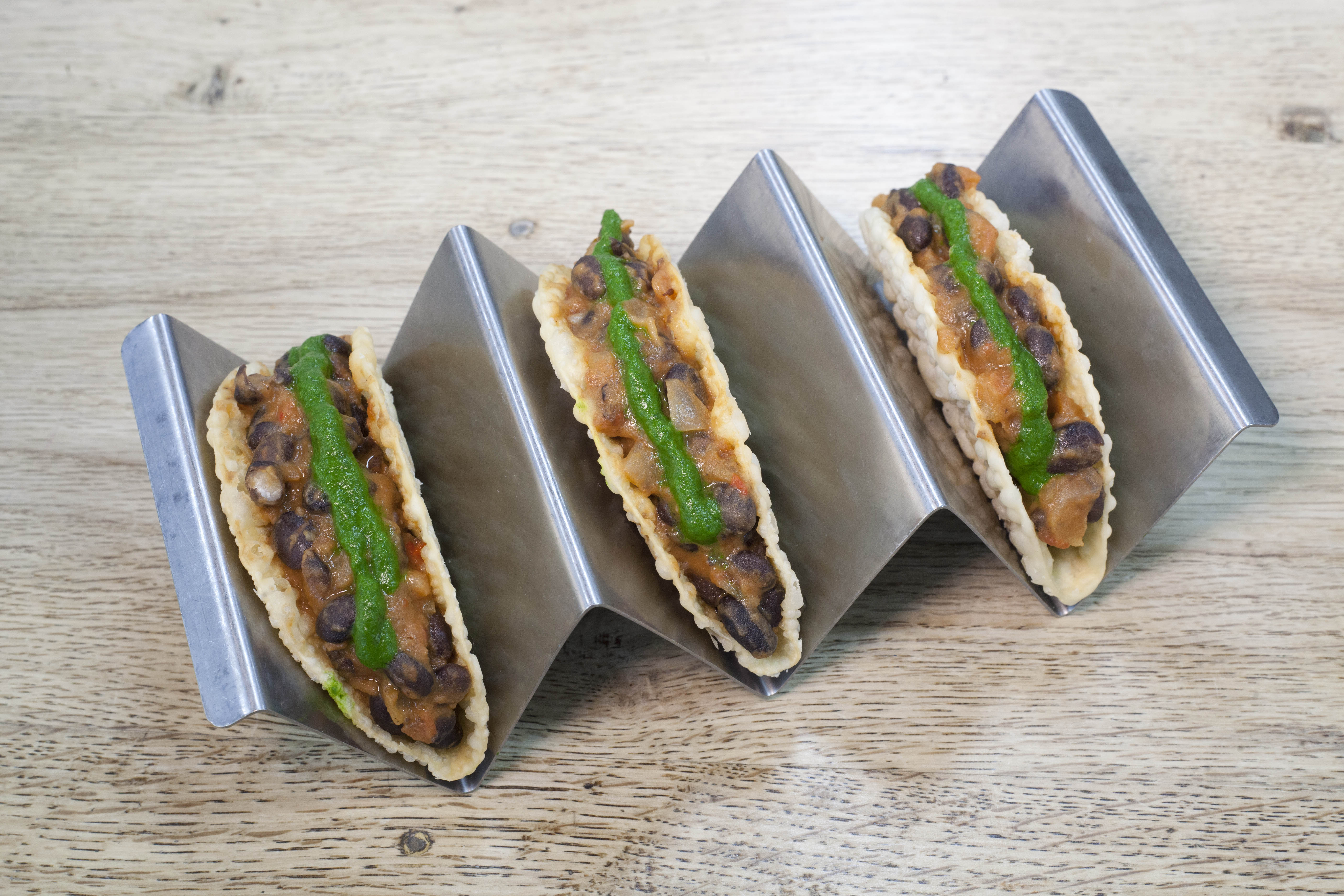 ‘Exquisite, their black-bean filling dark and rich’: black-bean gyoza tacos with coriander salsa