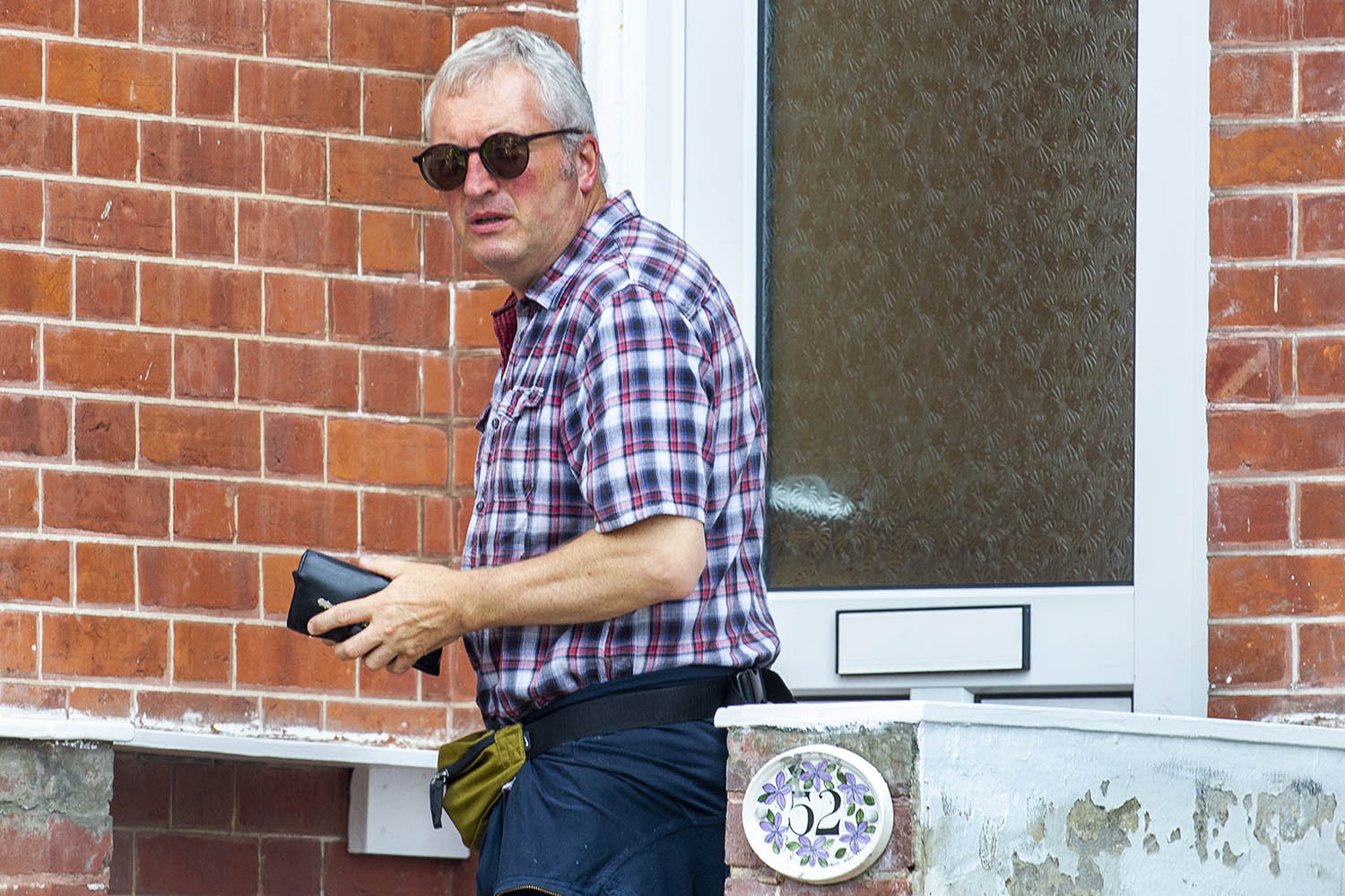 Peter Higgs on the doorstep of his home in Hastings, Sussex
