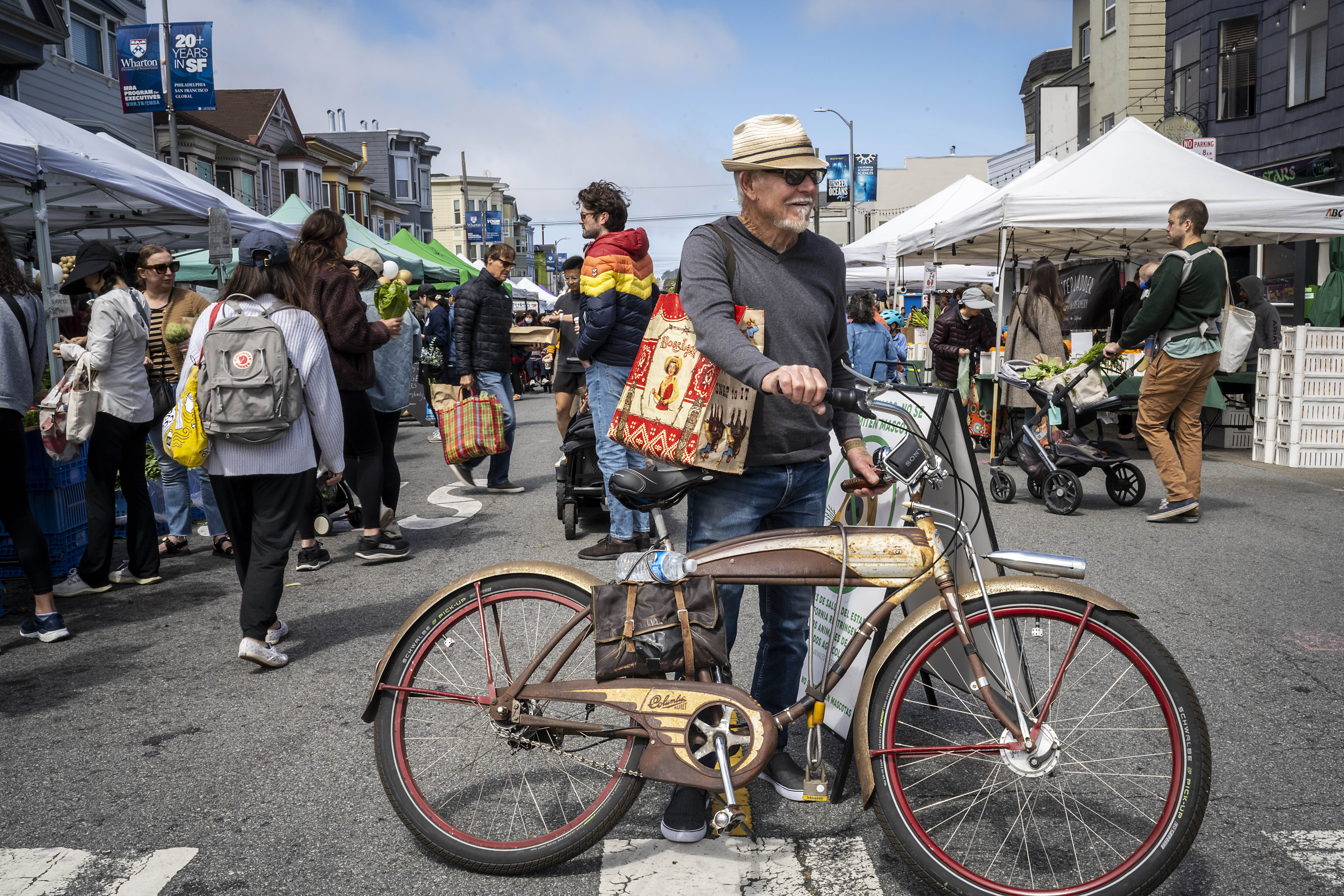 A local rides to the farmers’ market with a classic bicycle