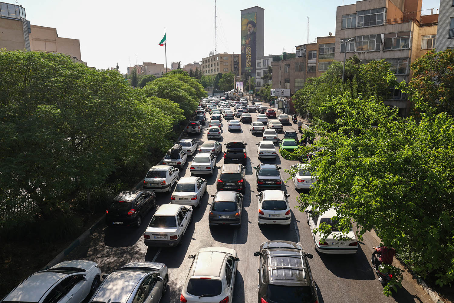 People flee Tehran through an artery in the city's west on 15 June.