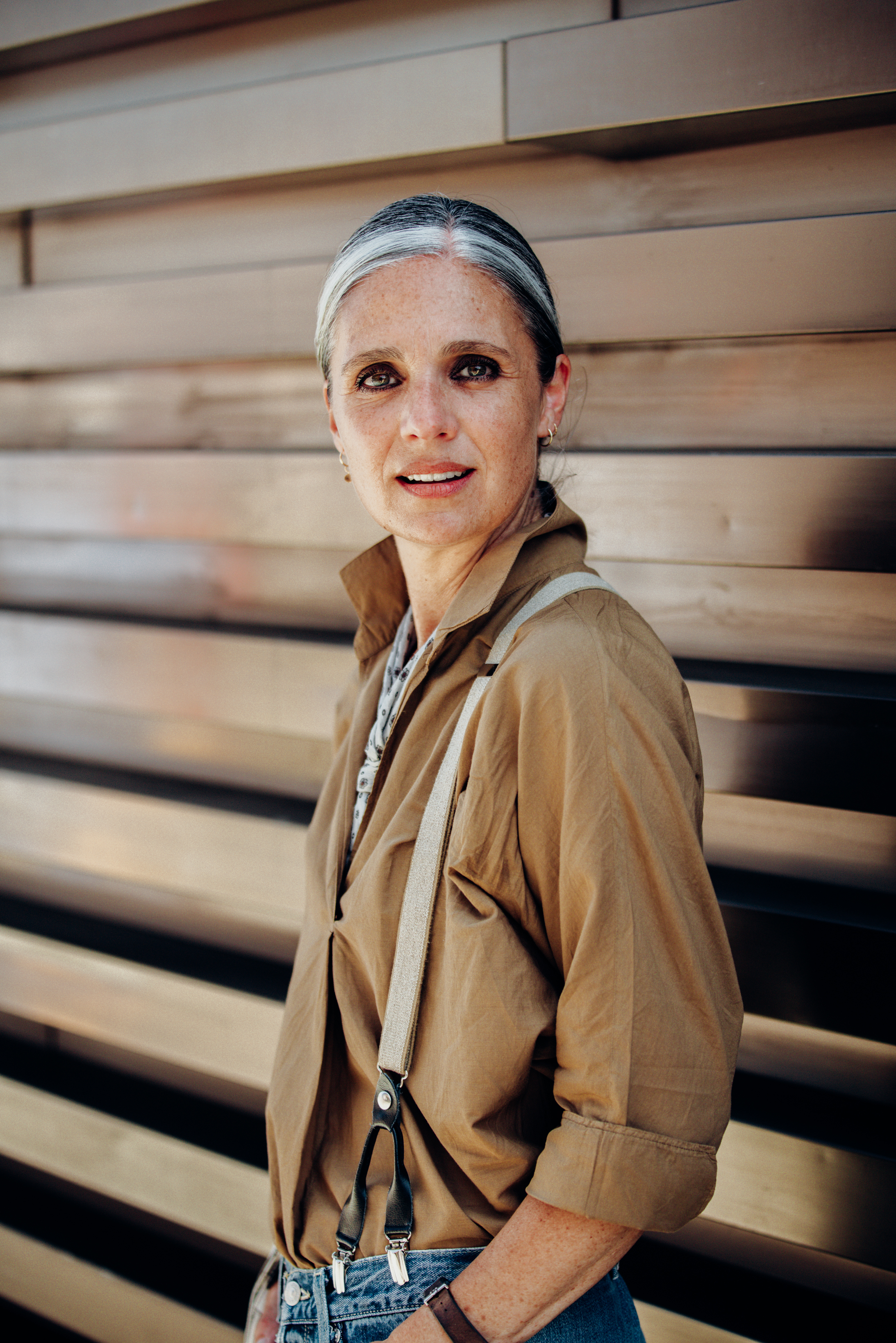 Cinzia Vedovato, visual merchandiser, wearing vintage braces with jeans