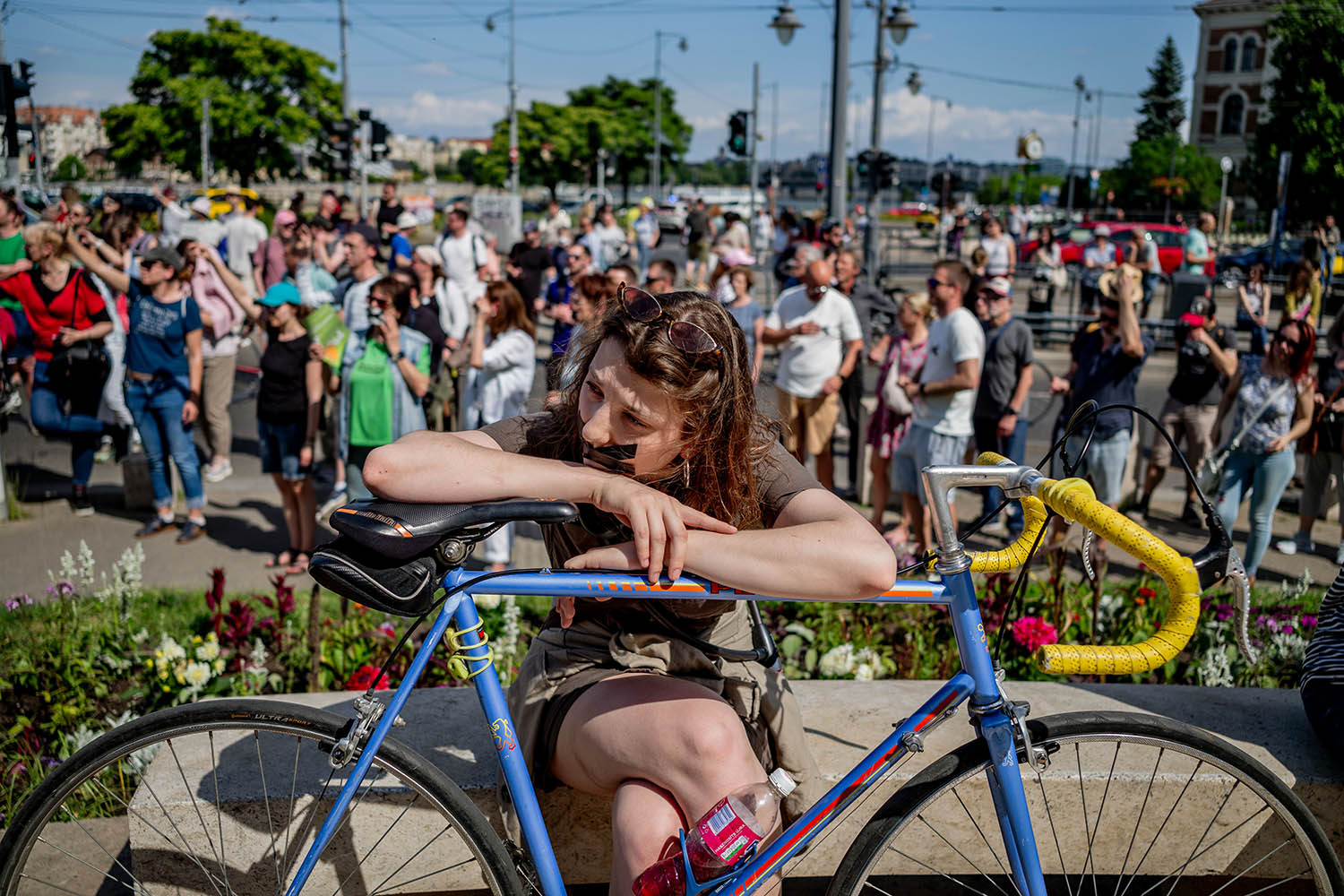 A protester against Orbán, her mouth taped. (Photograph by János Kummer Getty)