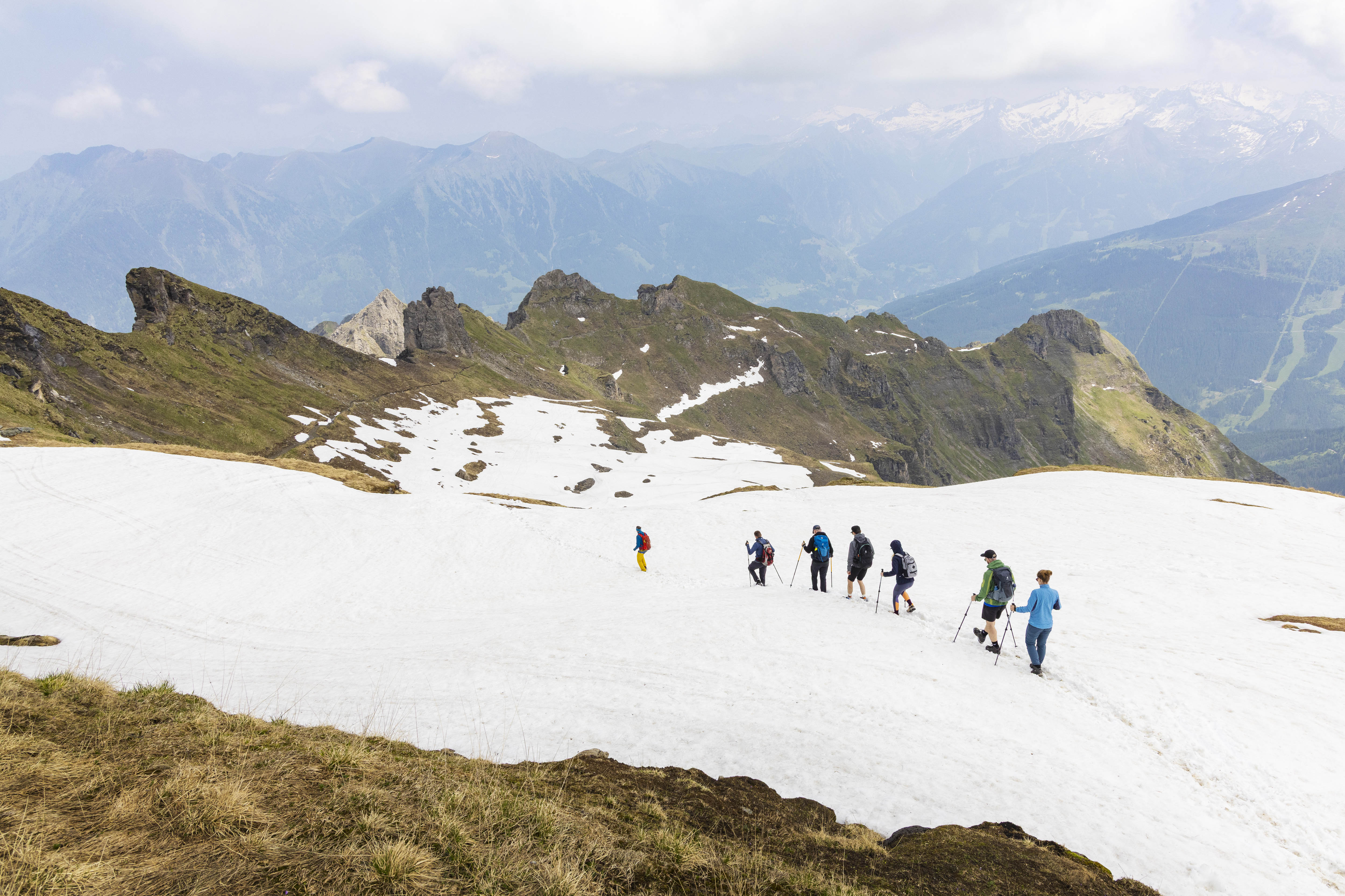 Step by step: Emma Cook and her fellow walking-pole equipped hikers make tracks across the snow