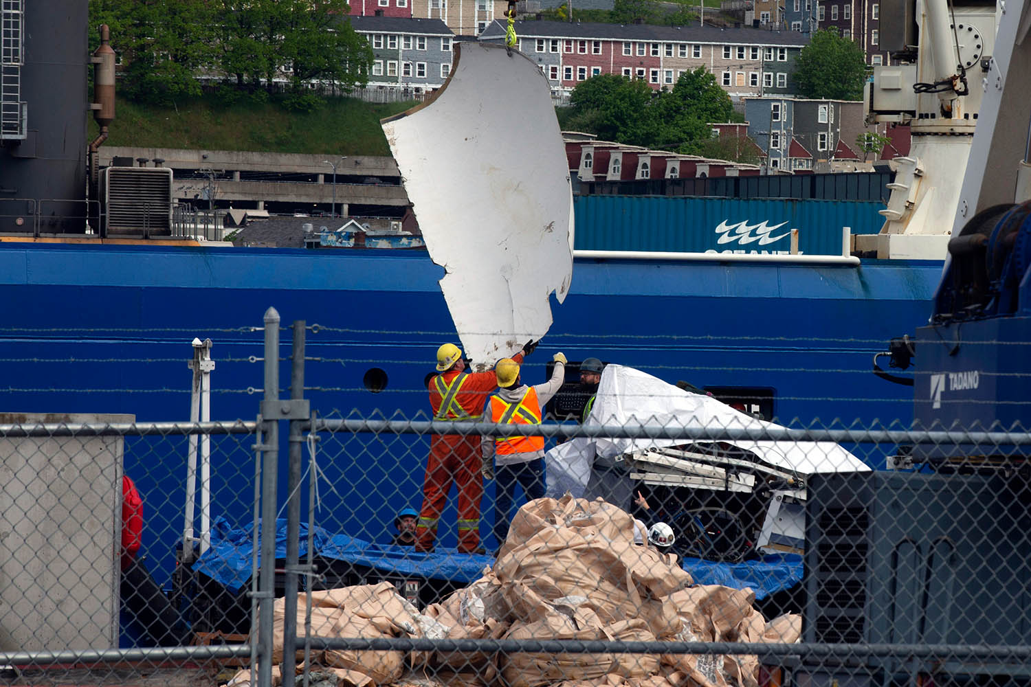 Debris from the Titan submersible, recovered from the ocean floor near the wreck of the Titanic, is unloaded from the ship Horizon Arctic at the Canadian Coast Guard pier in St. John's, Newfoundland