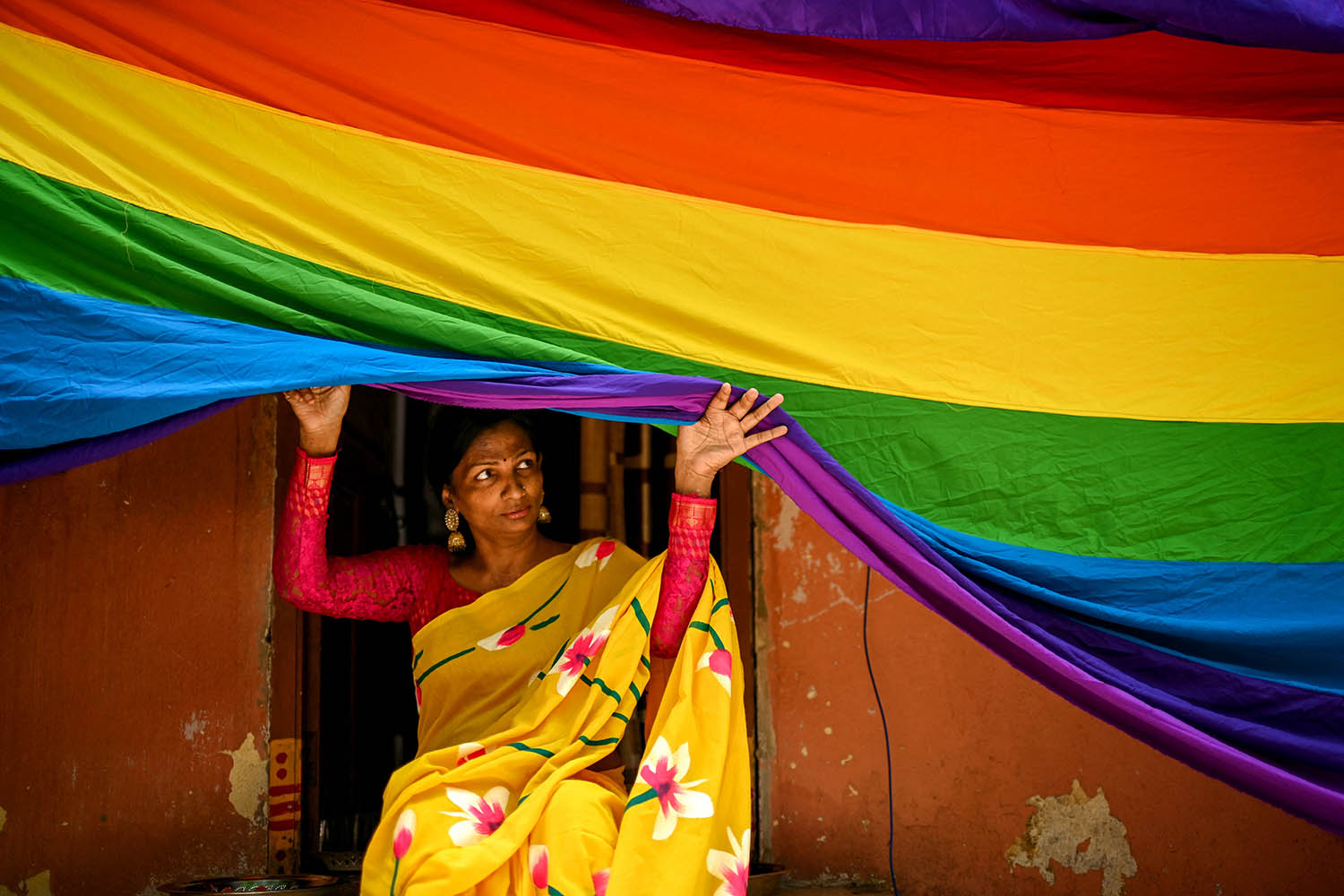 A rainbow flag is held aloft during a Pride event in Chennai on 31 May 31.