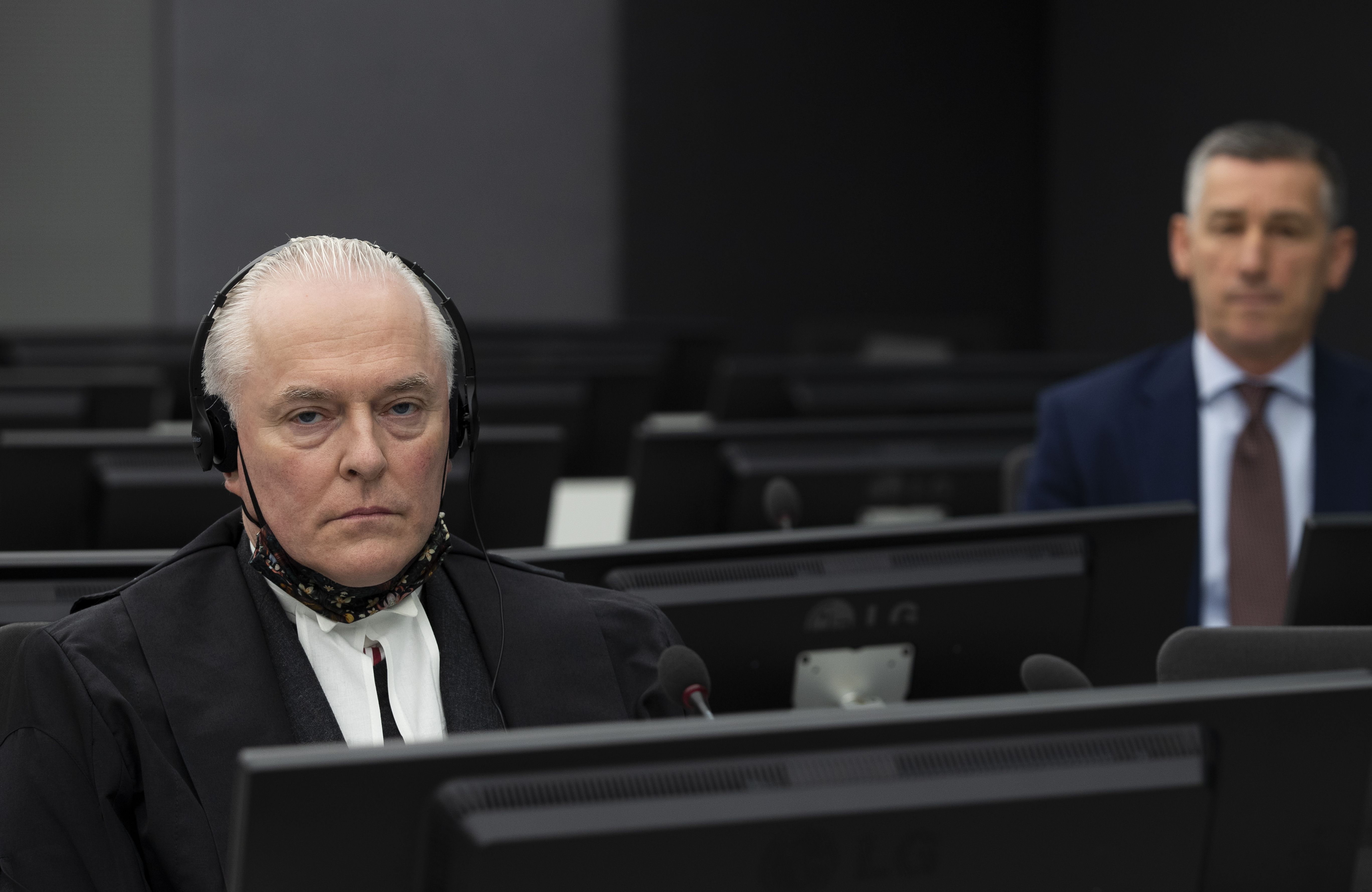 Andrew Cayley waits for the start of a court session in the Hague’s Kosovo Specialist Chambers court in 2020