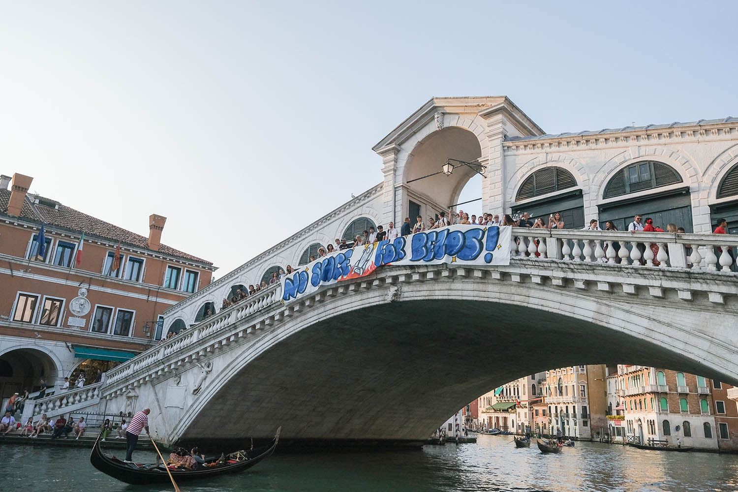 Activists displayed a banner on the Rialto Bridge to protest against the wedding.