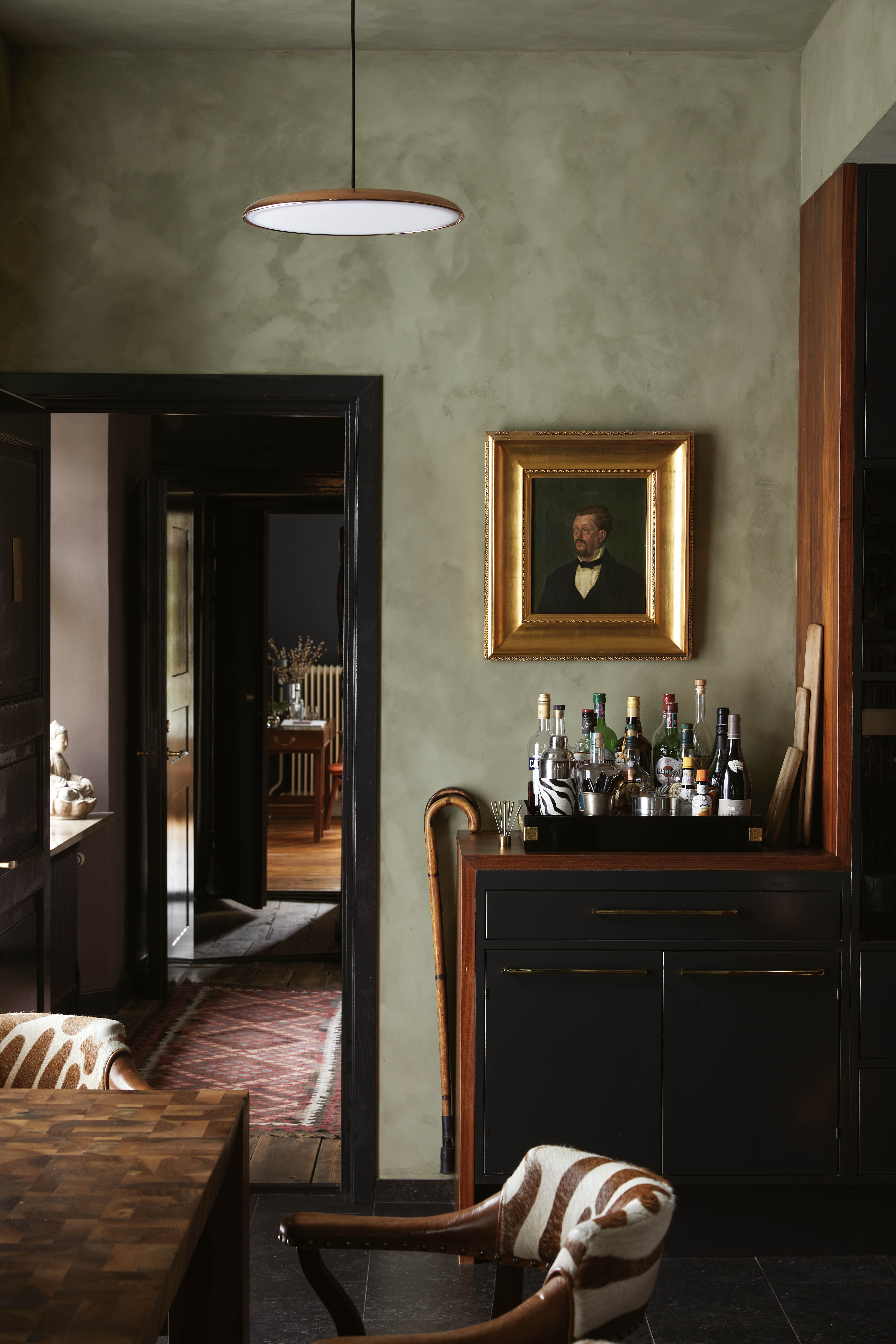Picture this: an oil painting in golden frame over the drinks trolley