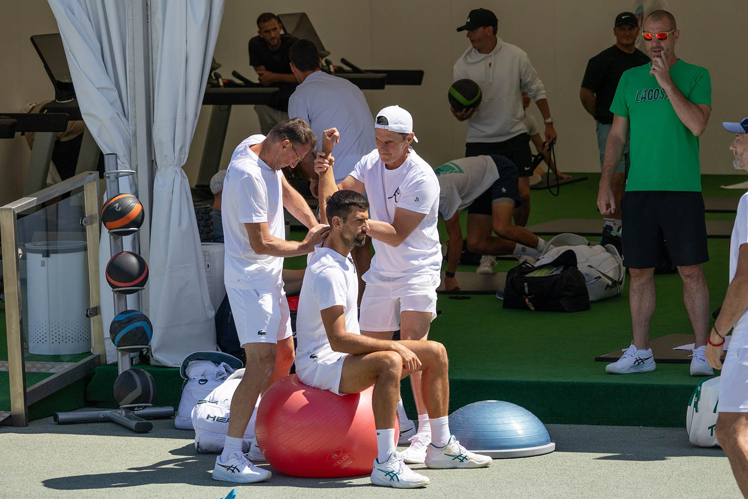 Djokovic get's some physio done before his match against Daniel Evans.