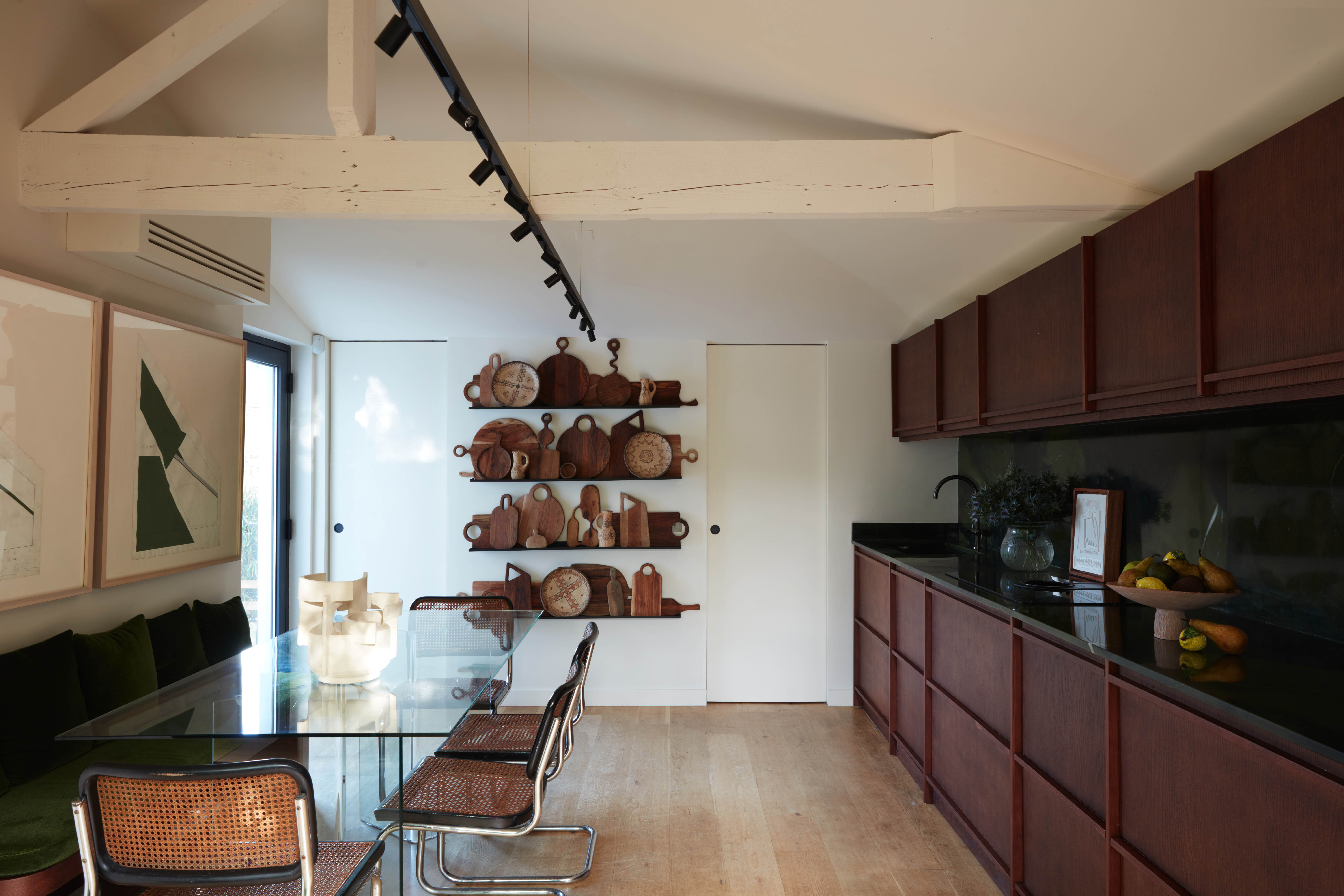 Comfort and joist: Breuer chairs and a velvet upholstered bench in the kitchen
