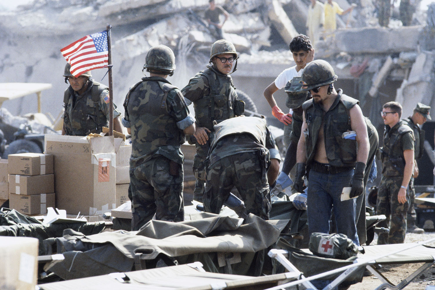 Marines search for survivors after a suicide car bomb was driven into their barracks headquarters in Beirut, killing 241 and wounding more than 60