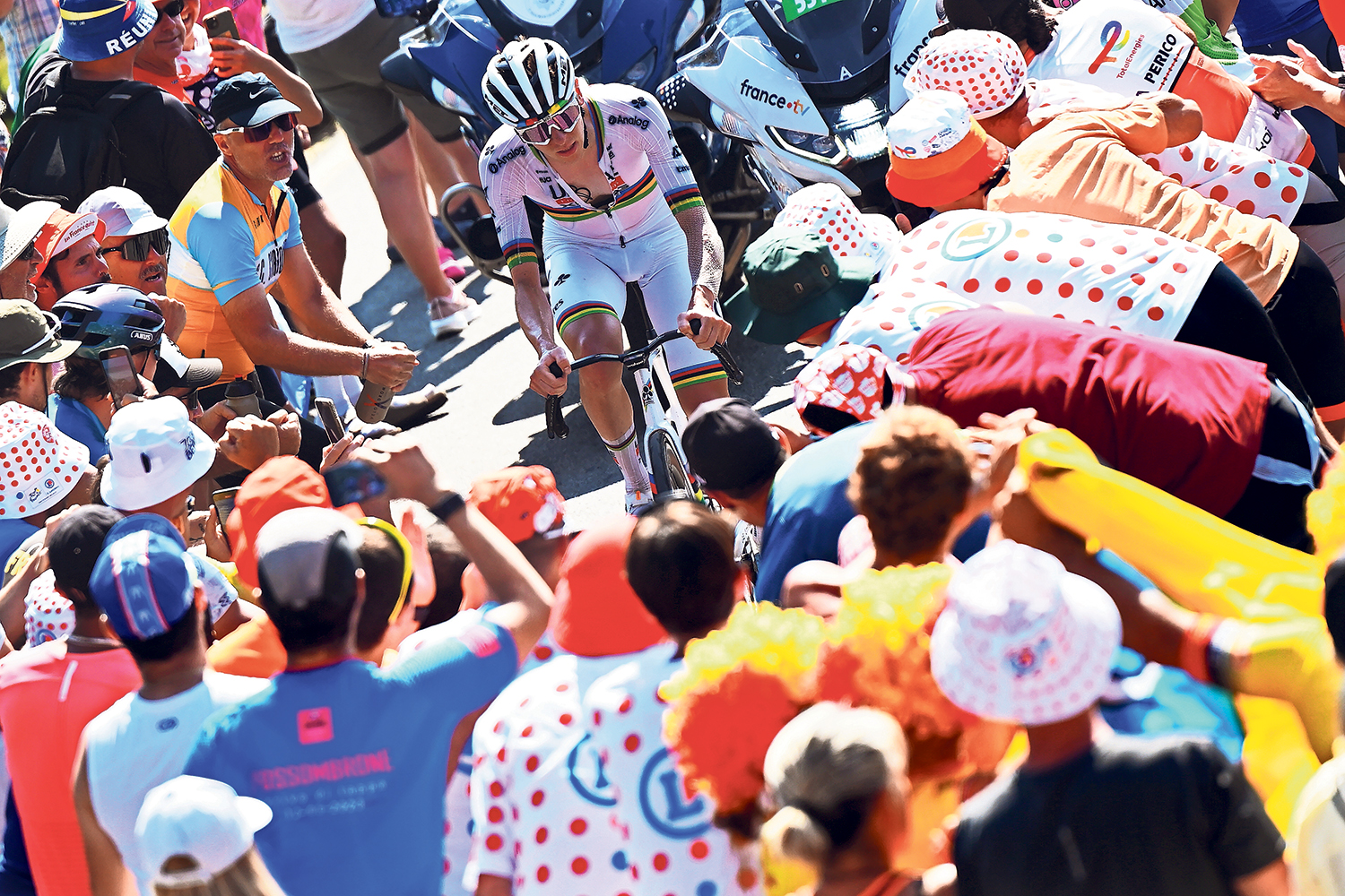 Fans waiting on the chain gang epitomises the beauty of Tour de France