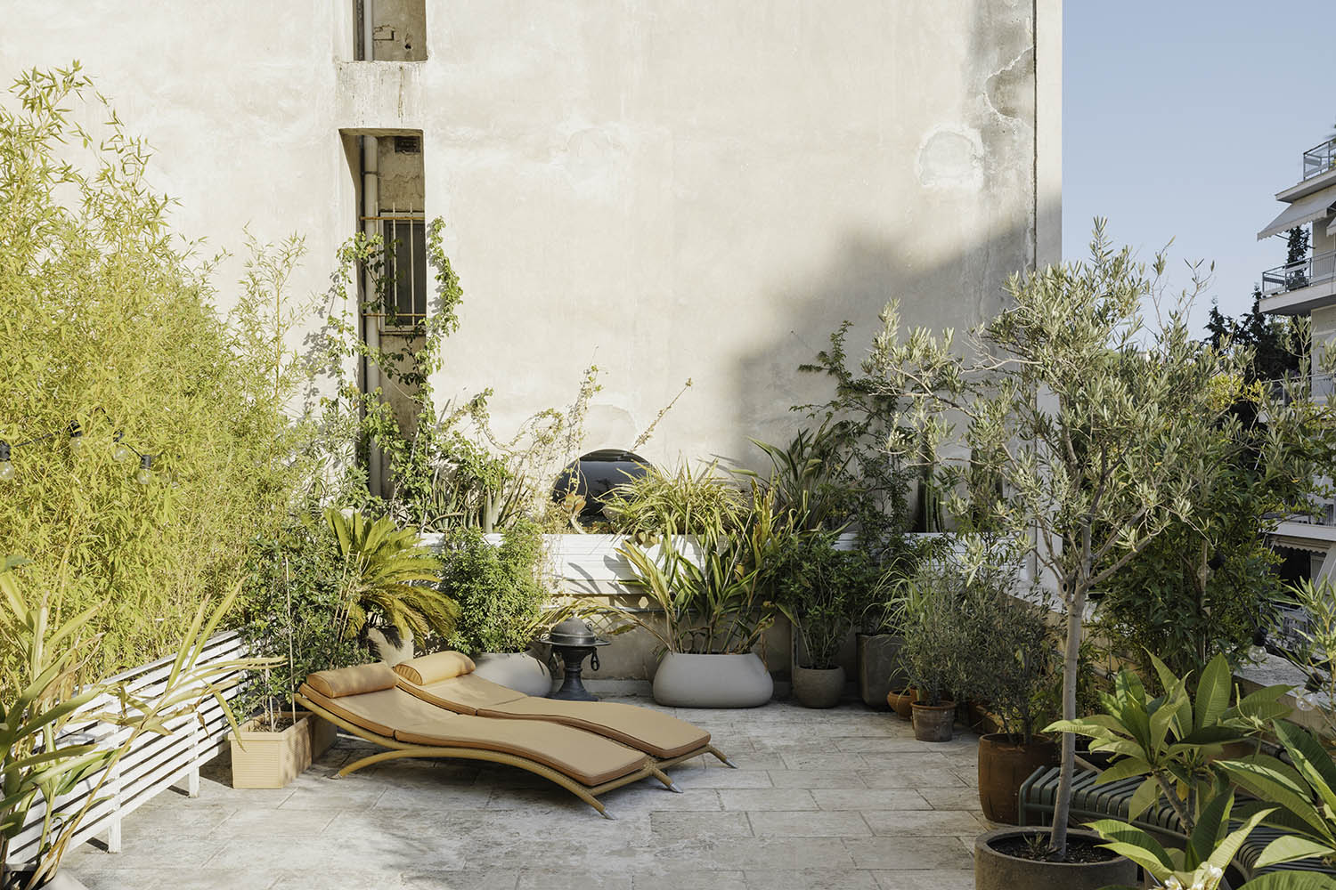 Take it outside: sun loungers on the terrace at Athens travel/design hub Insider Collective